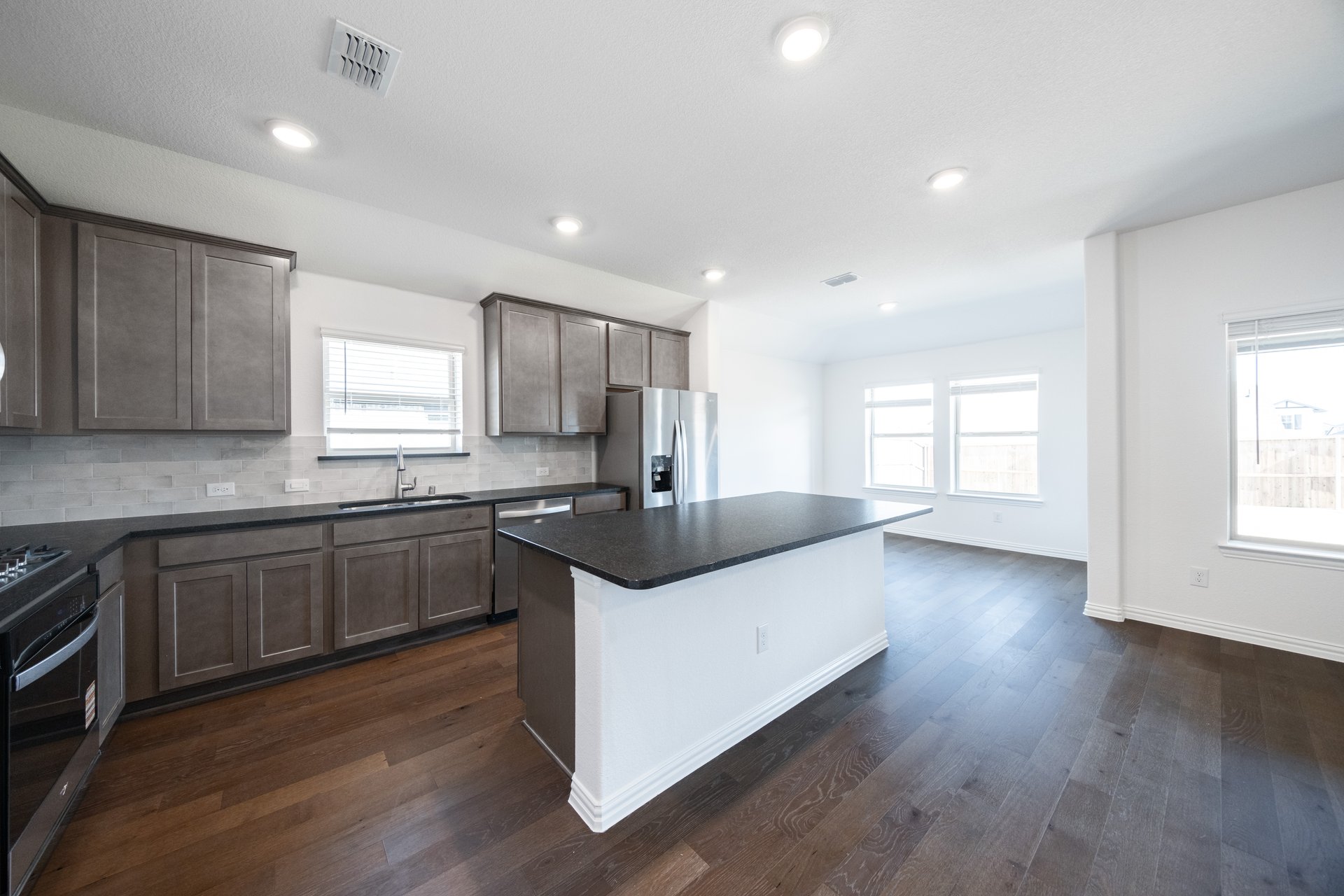 kitchen with dark cabinets and large island