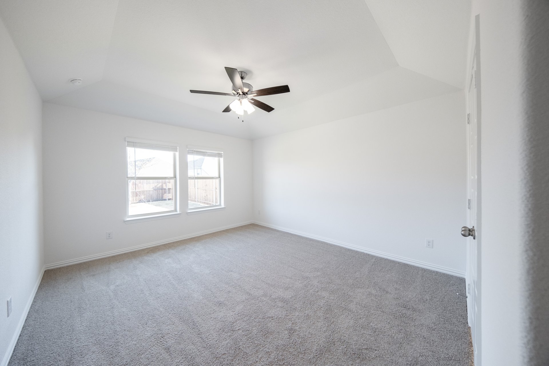 bedroom with carpet and ceiling fan