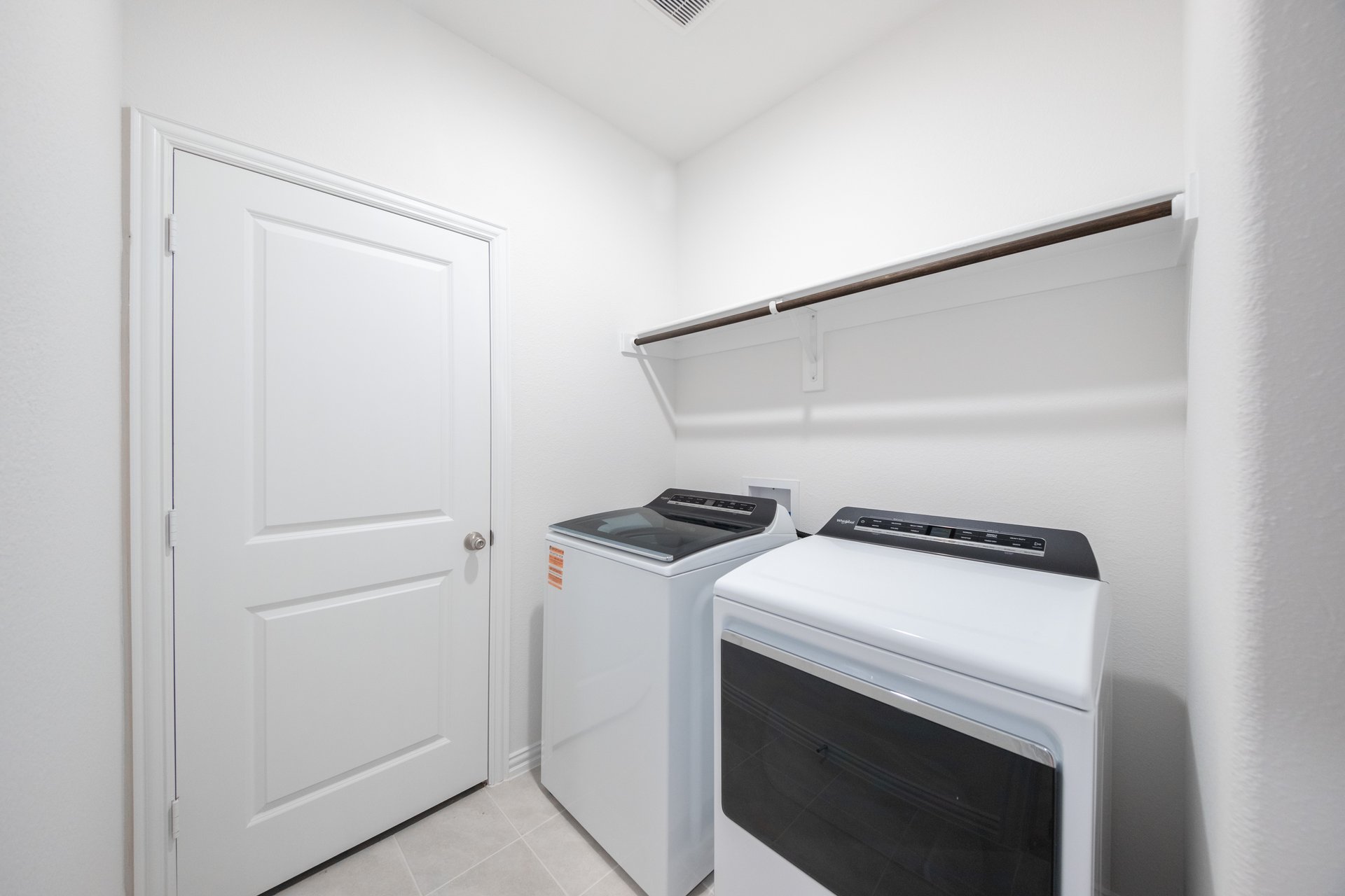 laundry room with included washer and dryer