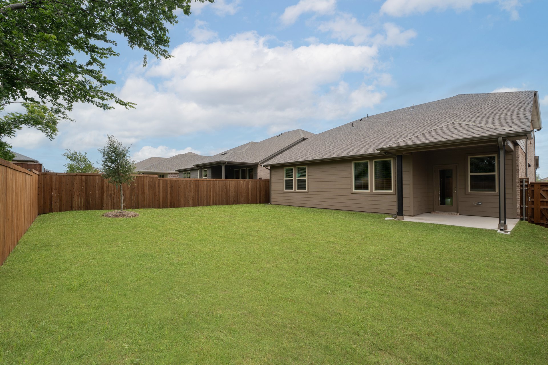 backyard with grass and covered patio