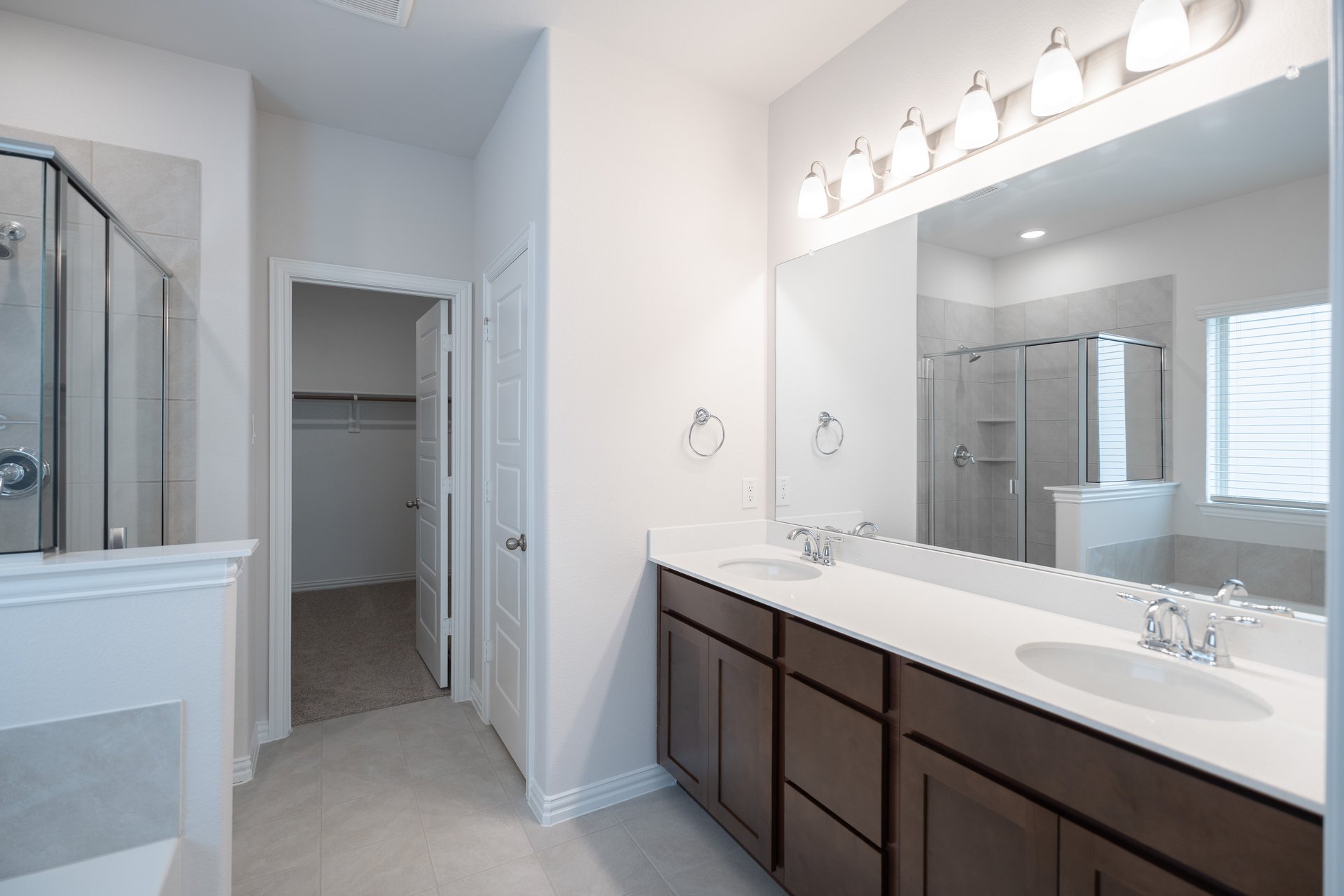 primary bathroom with soaking tub and walk-in shower
