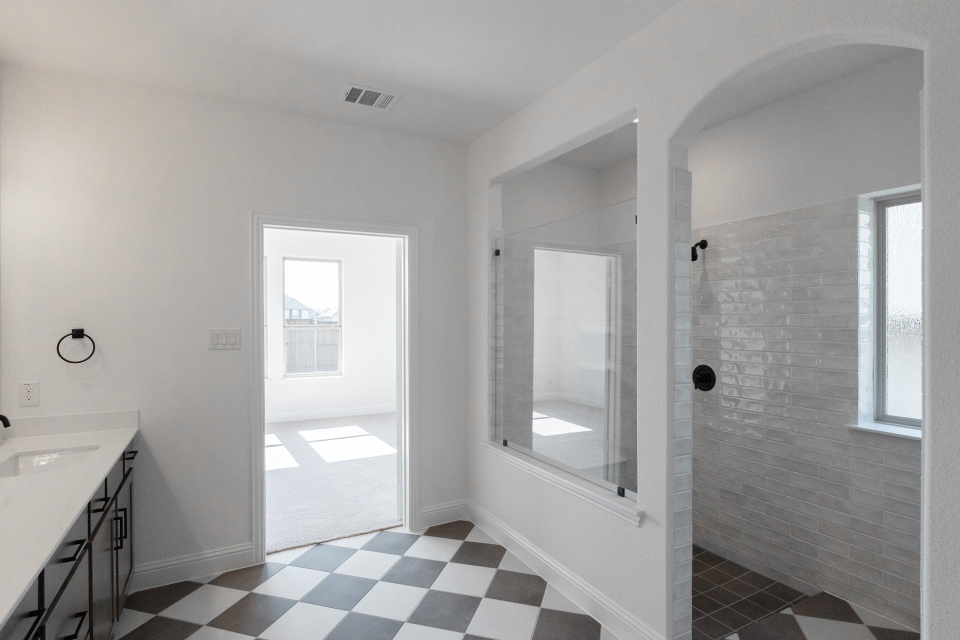 bathroom with large walk-in shower and tile