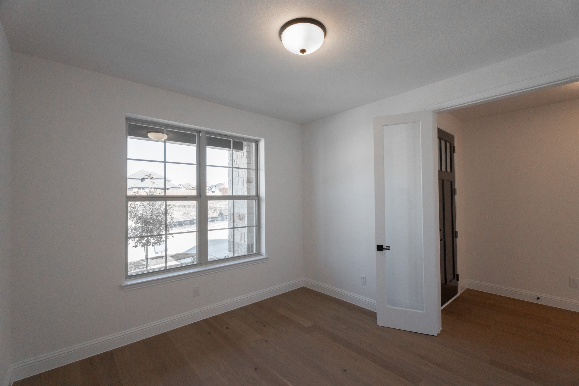 study with large window and french doors