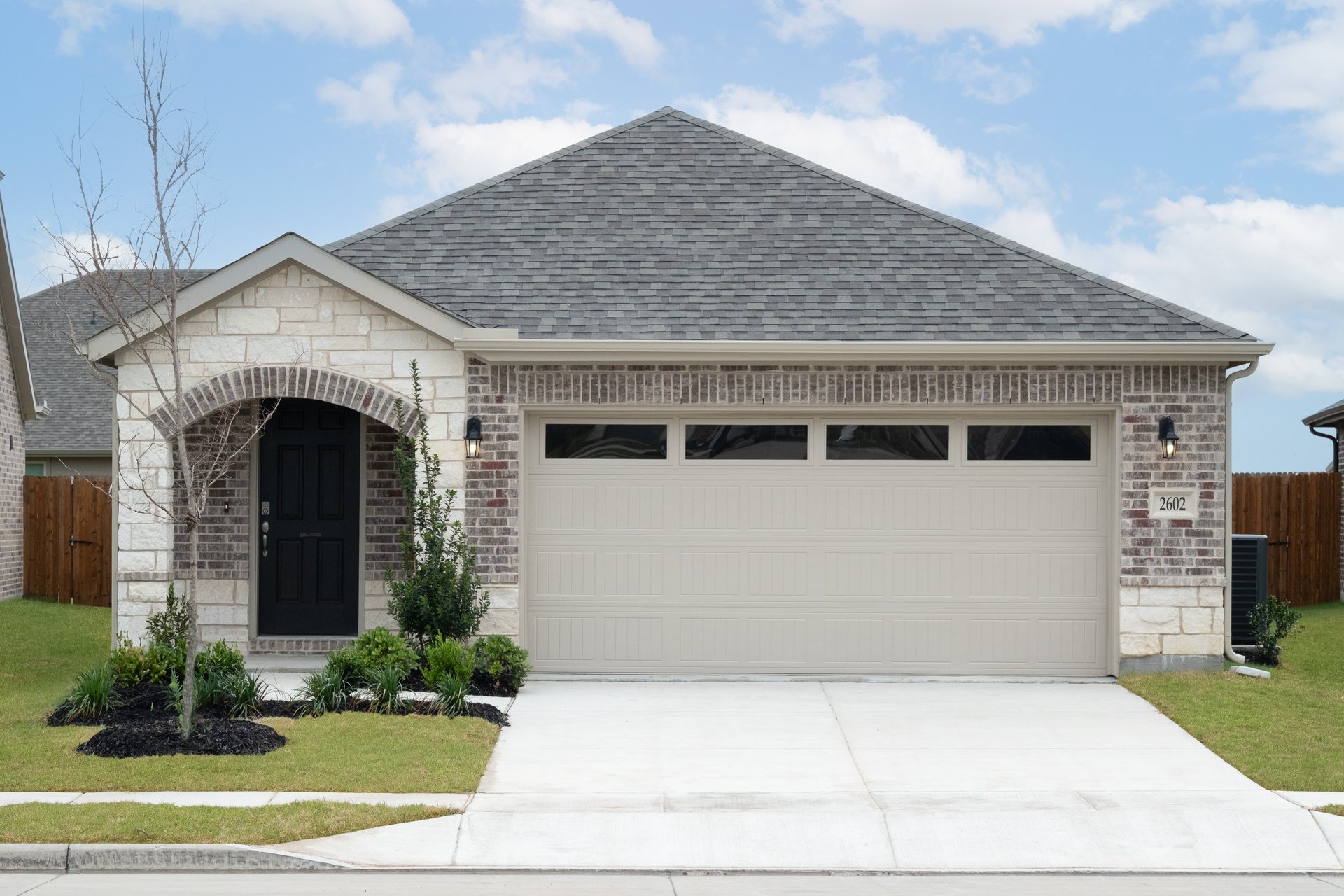 one-story with brick and stone exterior