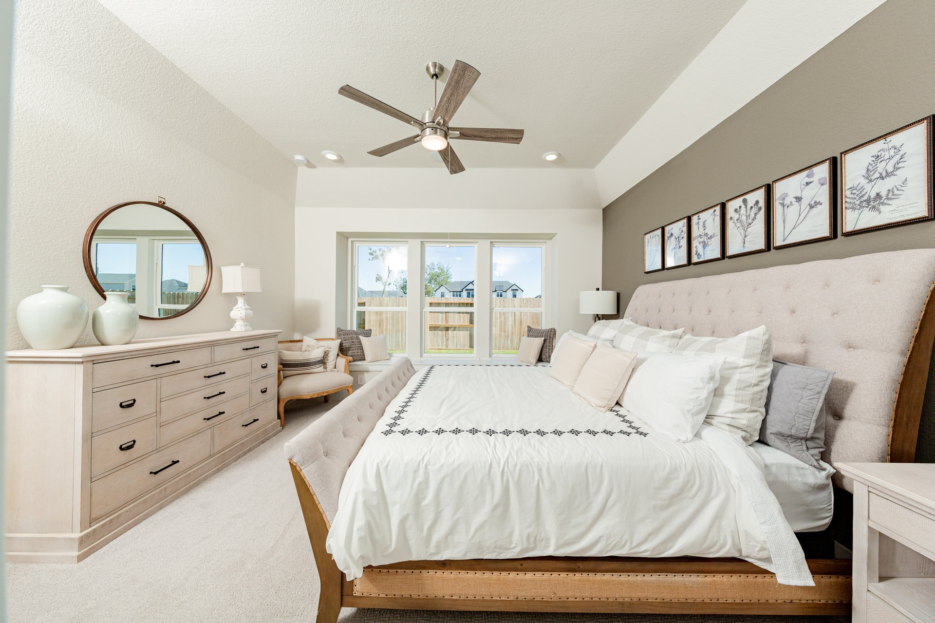 spacious primary bedroom with carpet