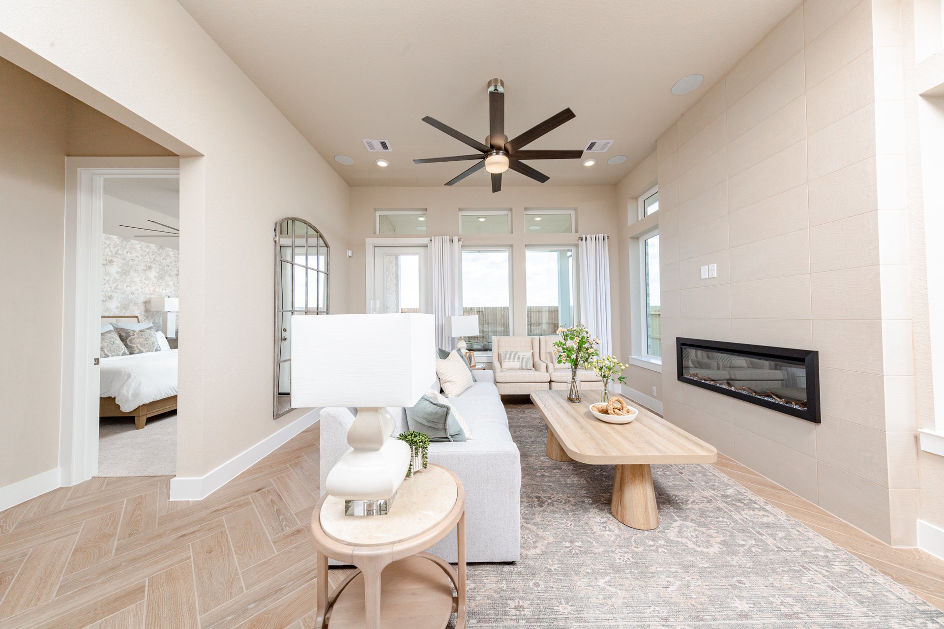 great room with sofa and ceiling fan