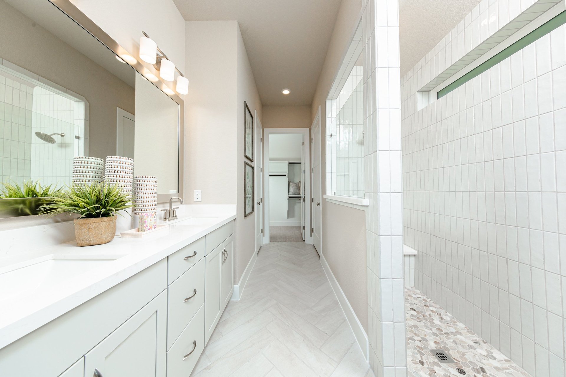 bathroom with walk-in shower and large mirror