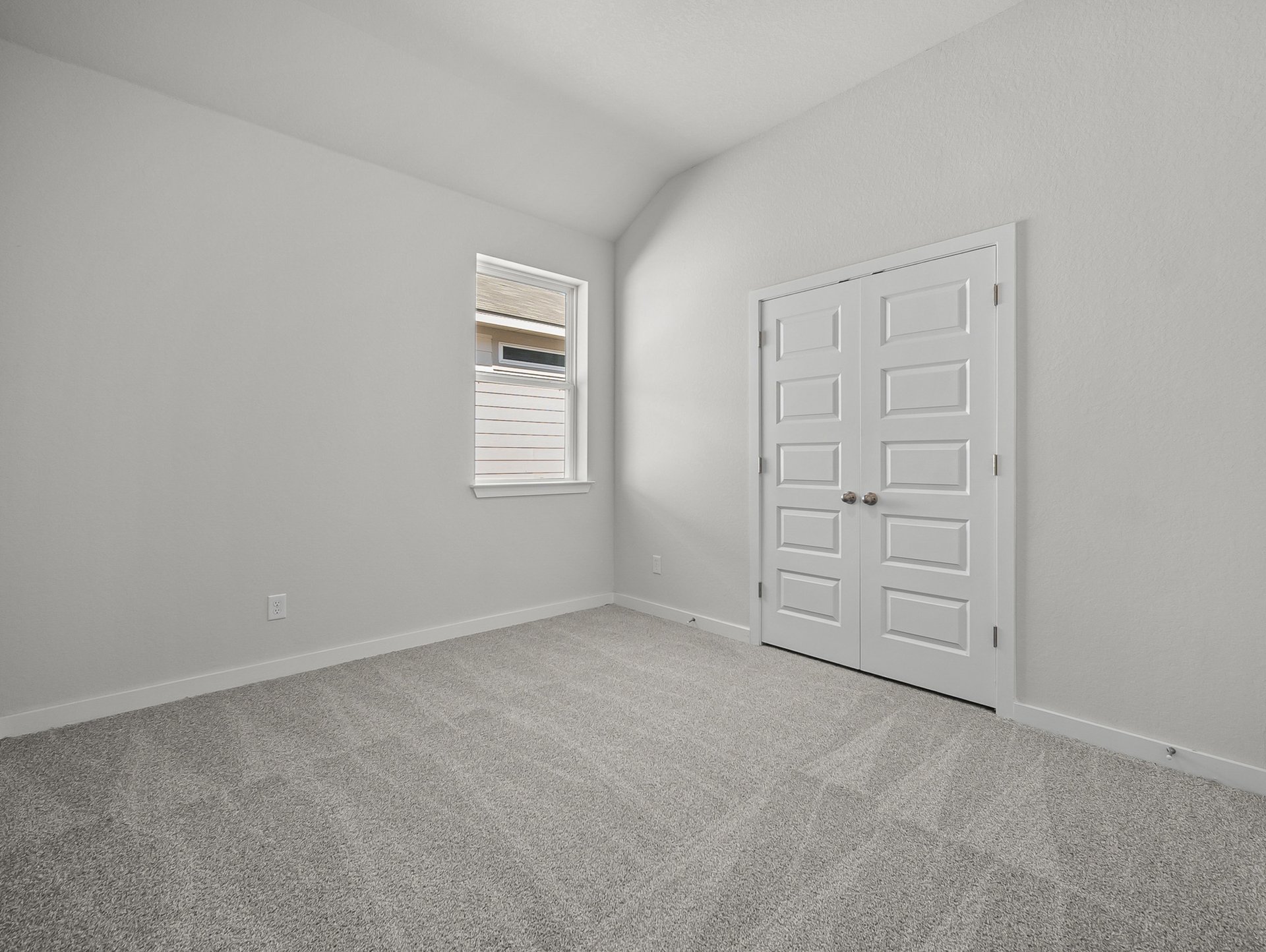 bedroom with carpet, a window & a closet