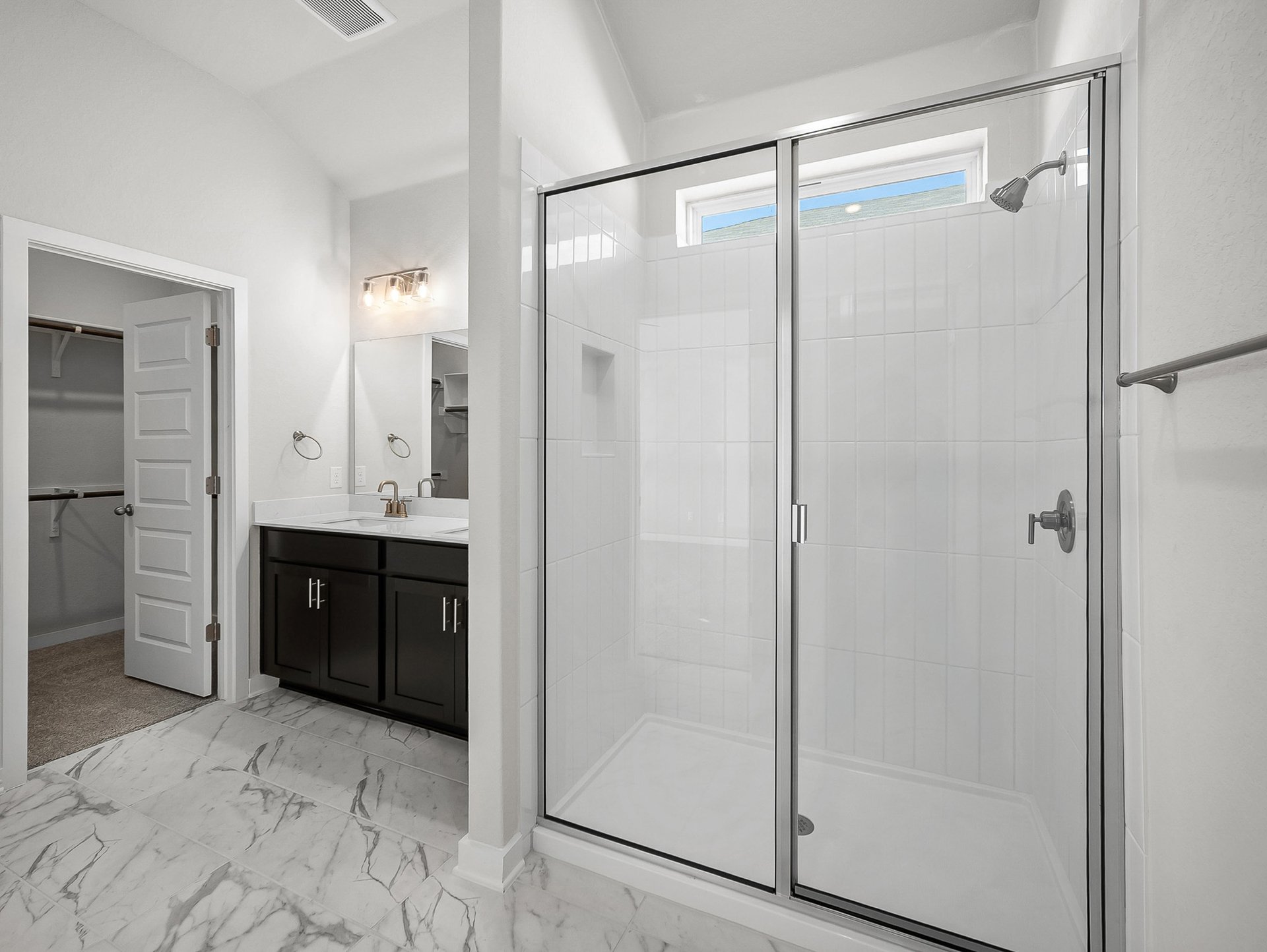 bathroom with a walk-in shower & quartz countertops