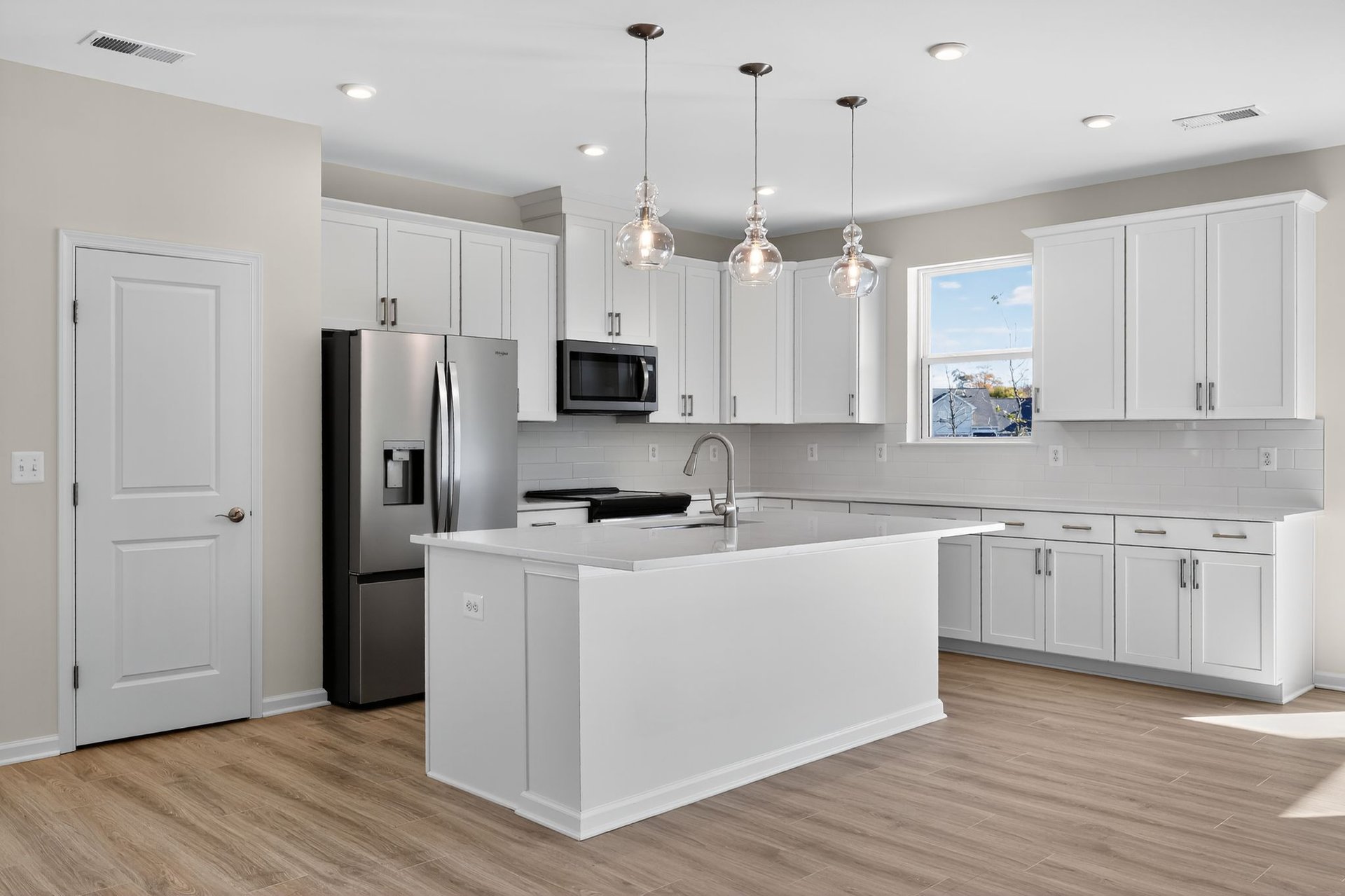 kitchen with white cabinets and a center island