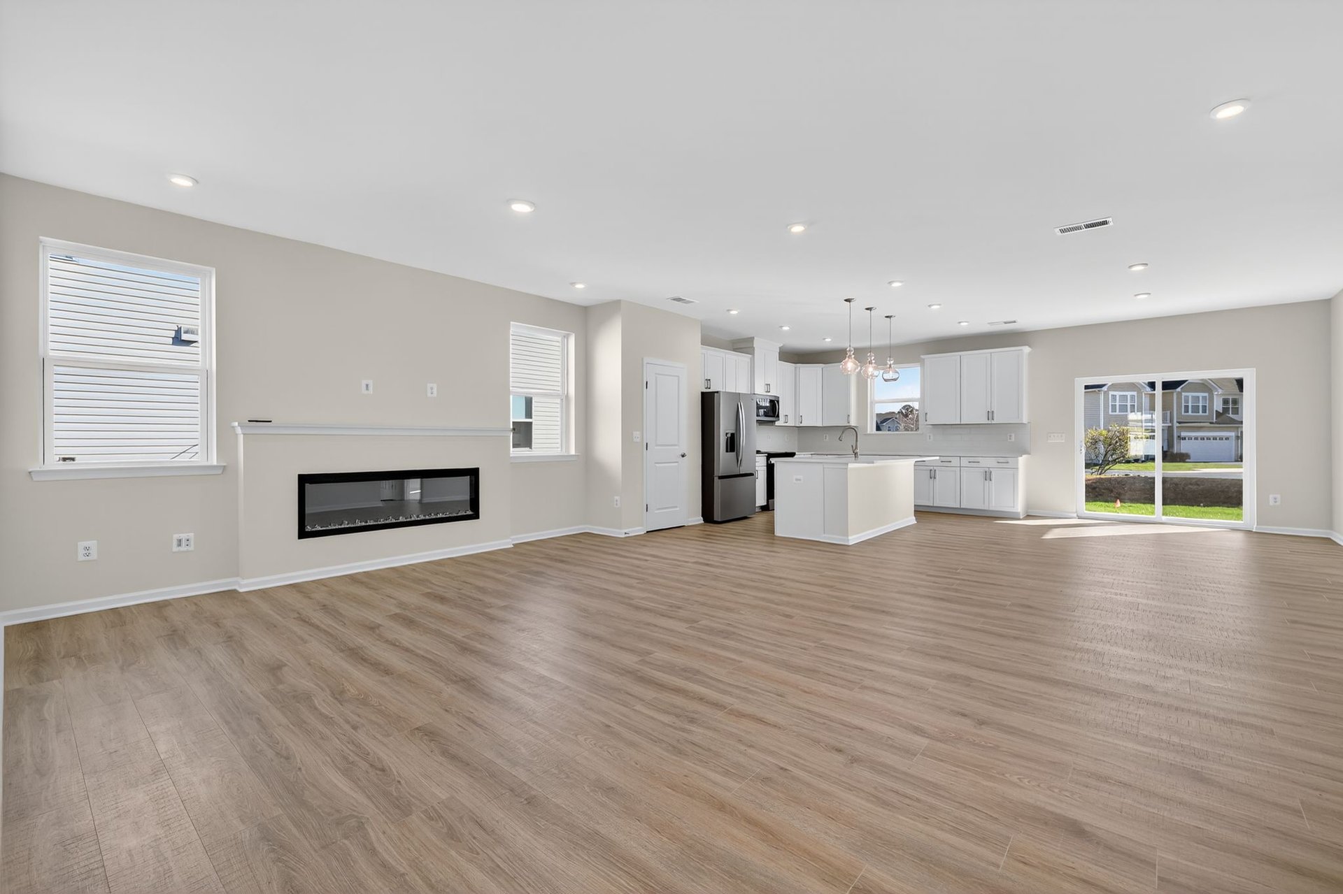 open great room with an electric fireplace