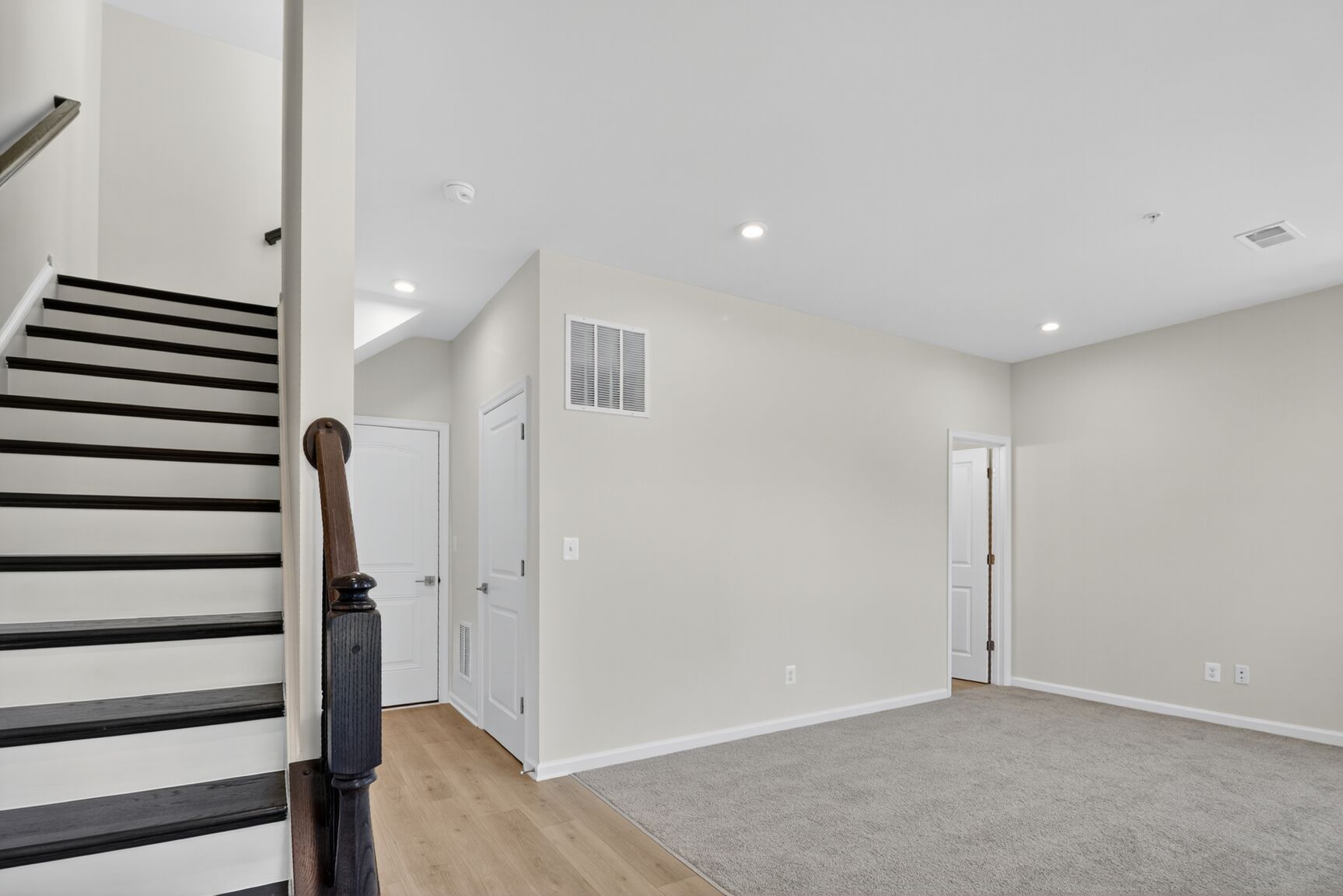 finished entry level recreation room with carpet