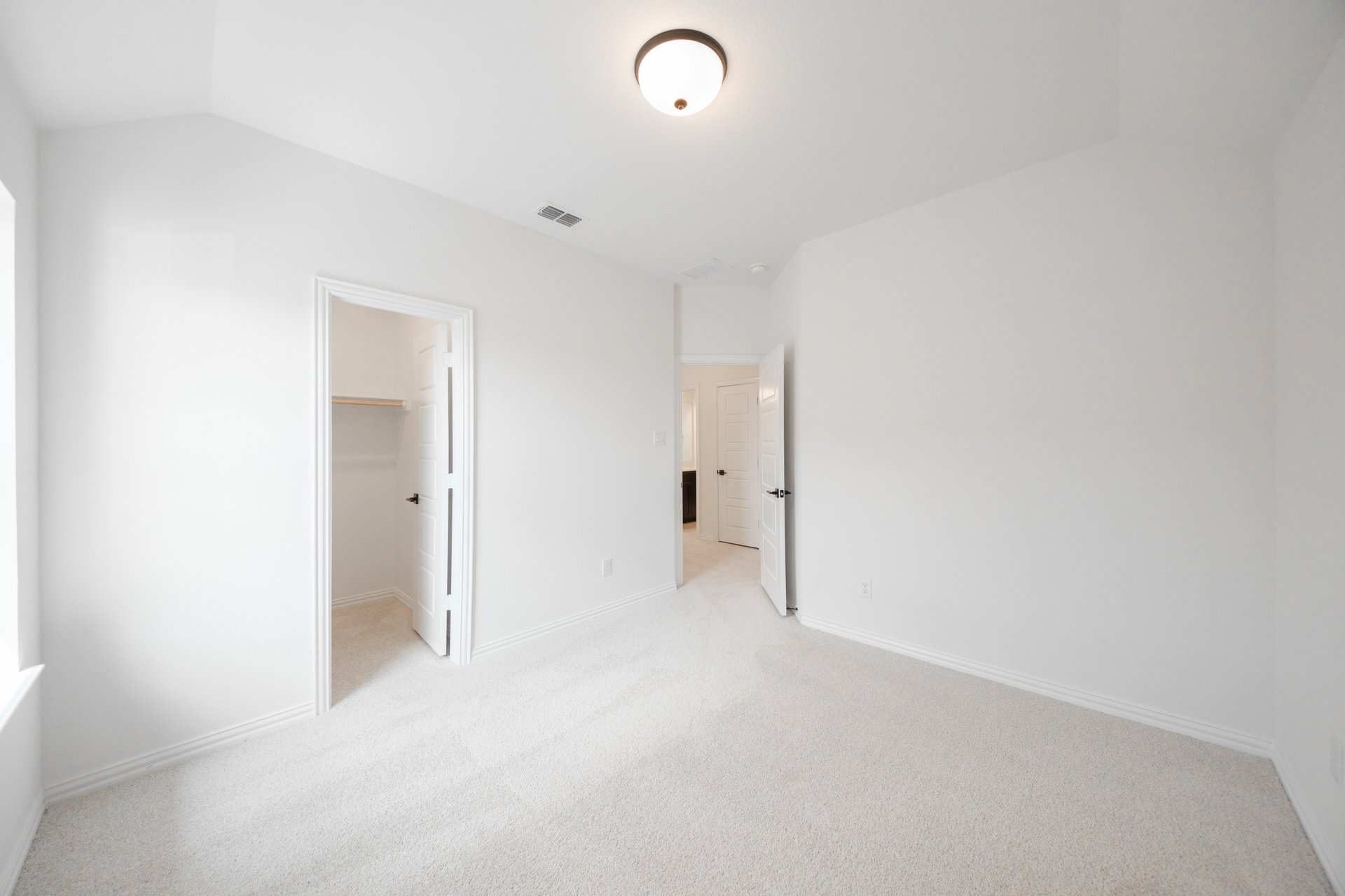guest bedroom with carpet