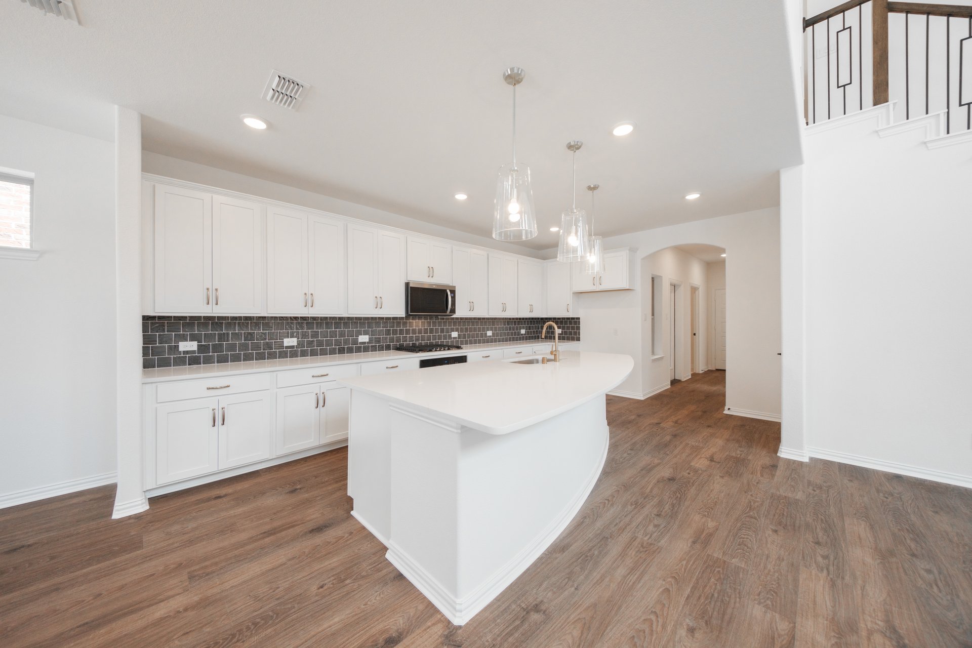 open kitchen with white cabinets