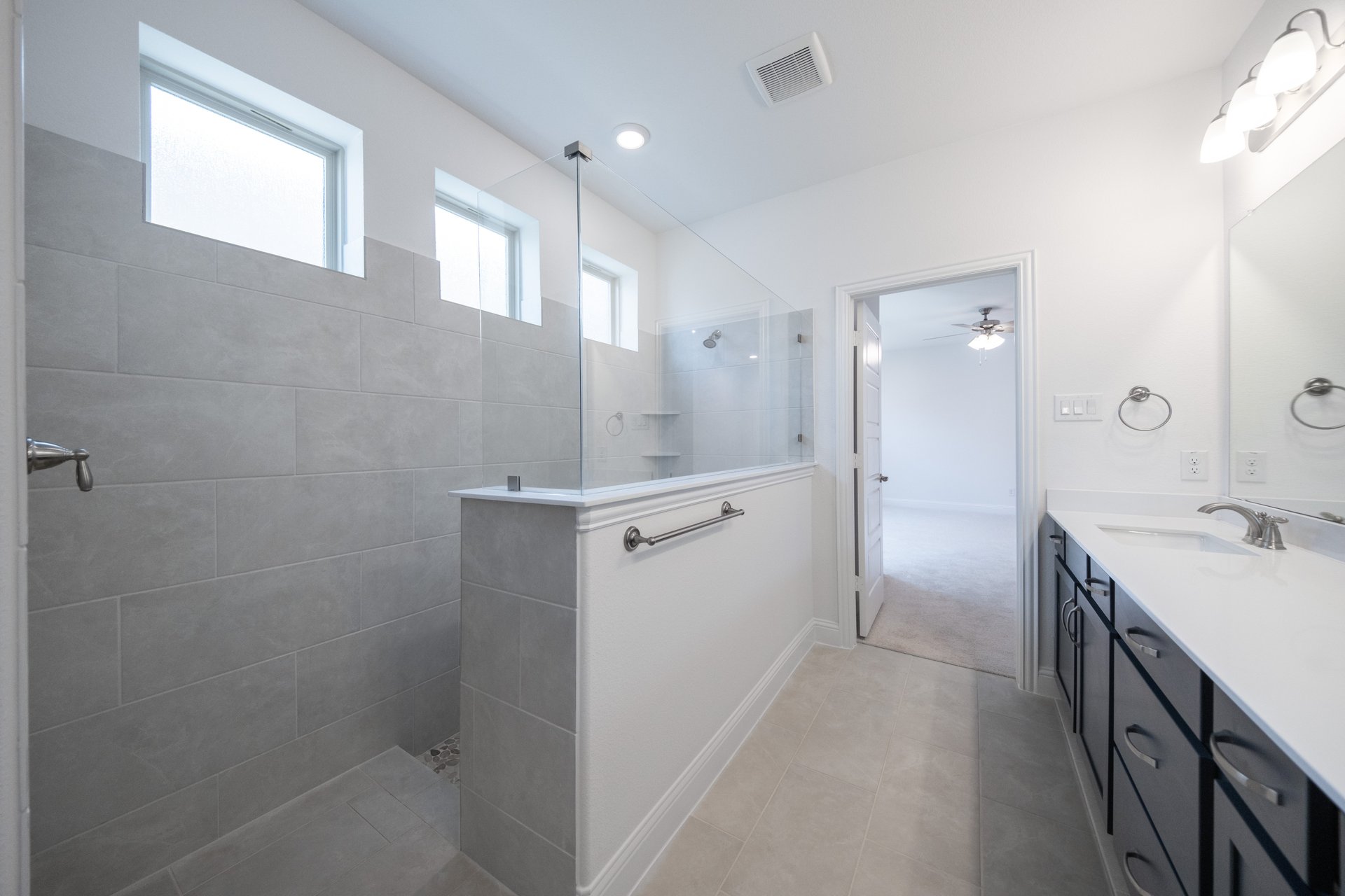 large primary bathroom with walk-in shower
