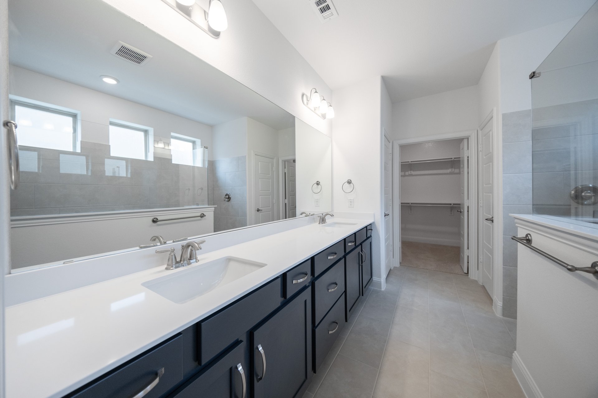spacious primary bathroom with double sinks
