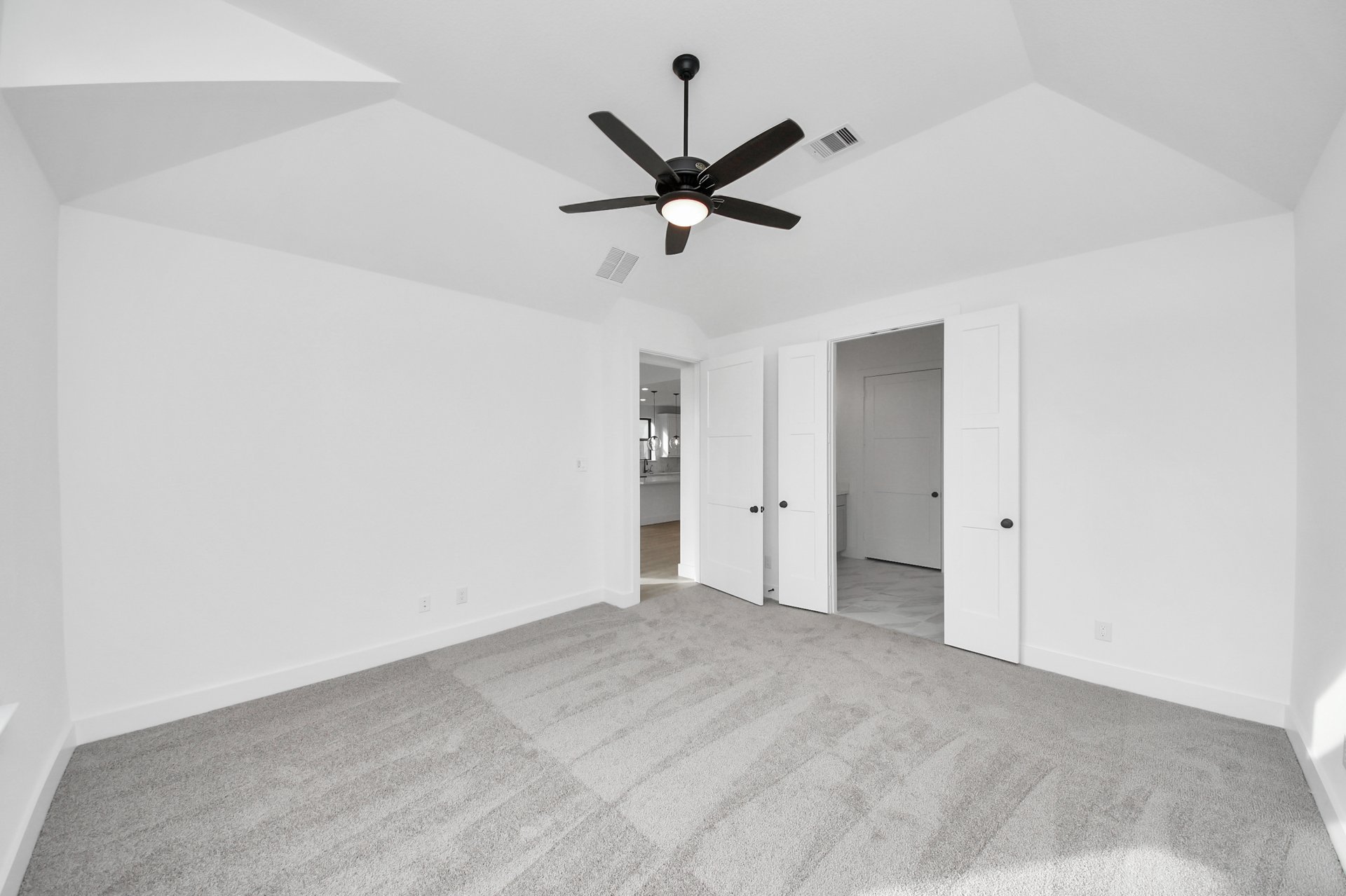 oversized room with carpet and tall ceilings