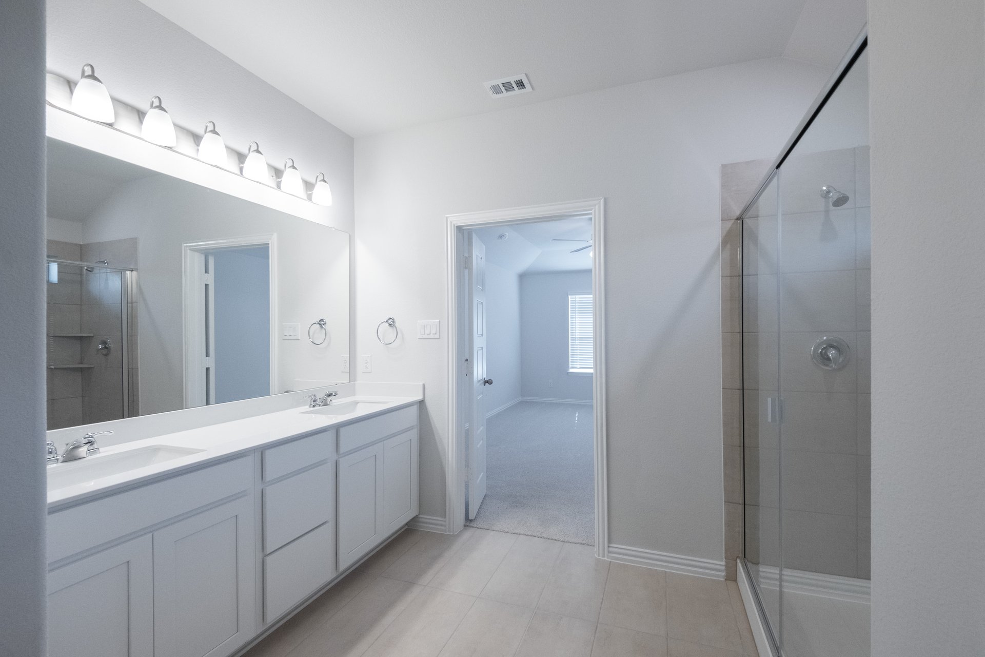 primary bathroom with large walk-in shower