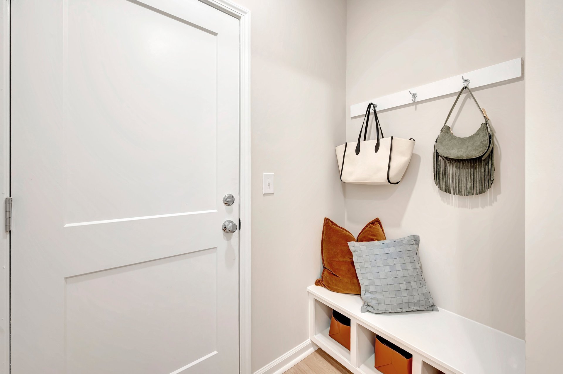 mudroom with a bench and hooks