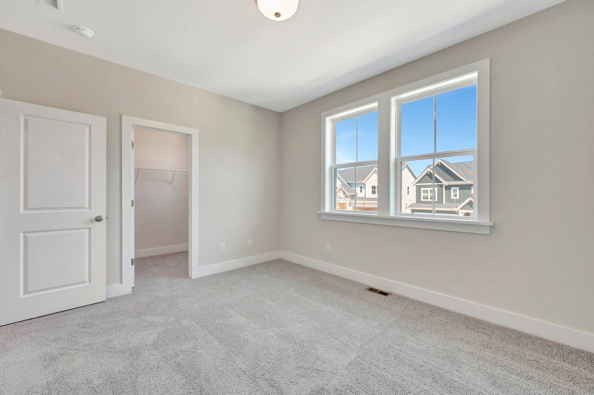 secondary bedroom with two windows