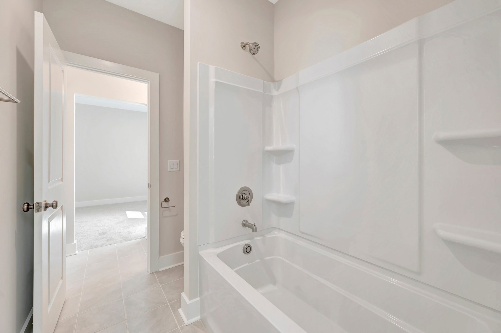 secondary bathroom with a shower and tub combo
