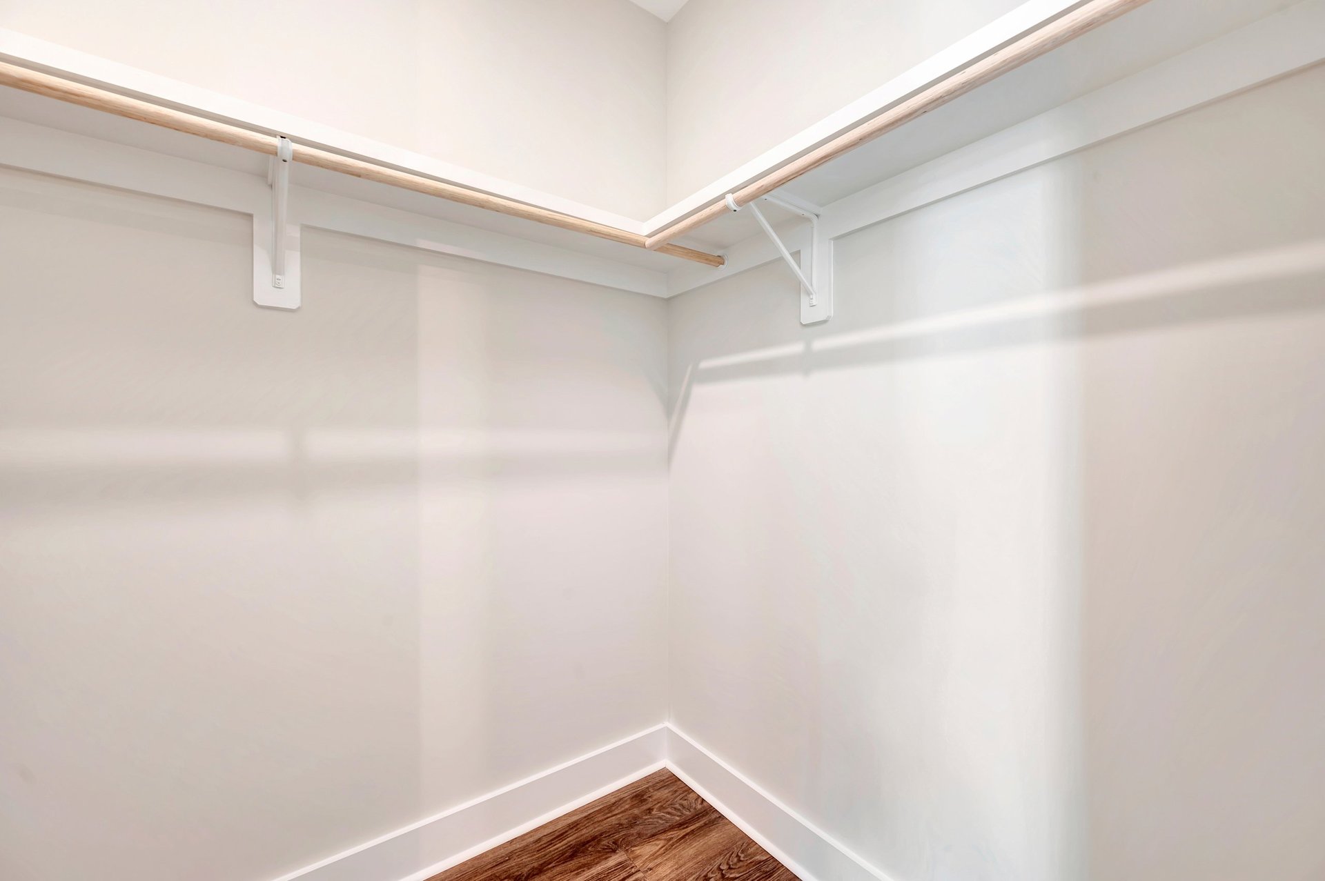 walk-in closet with wood shelves