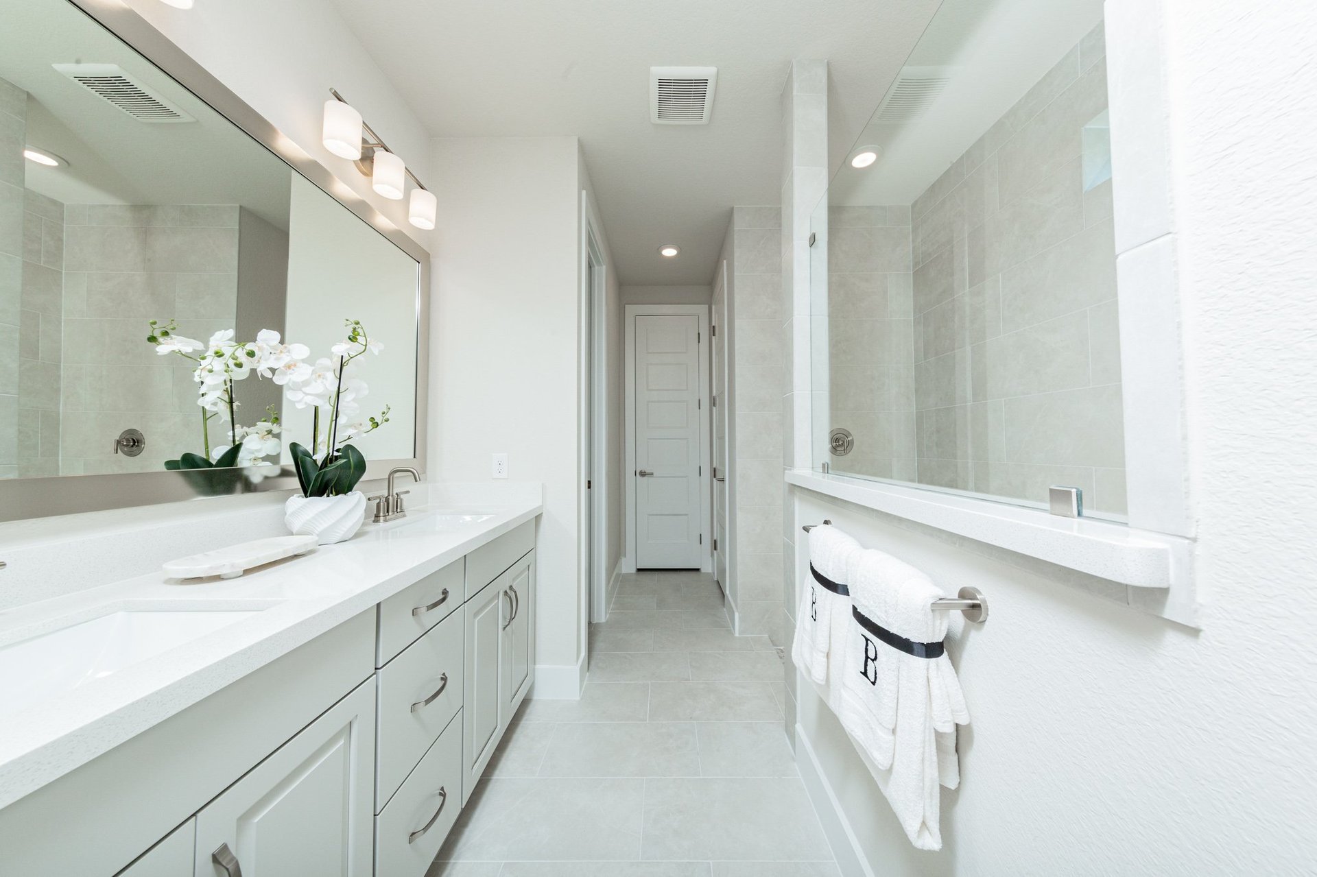 bathroom with double sinks and mirror