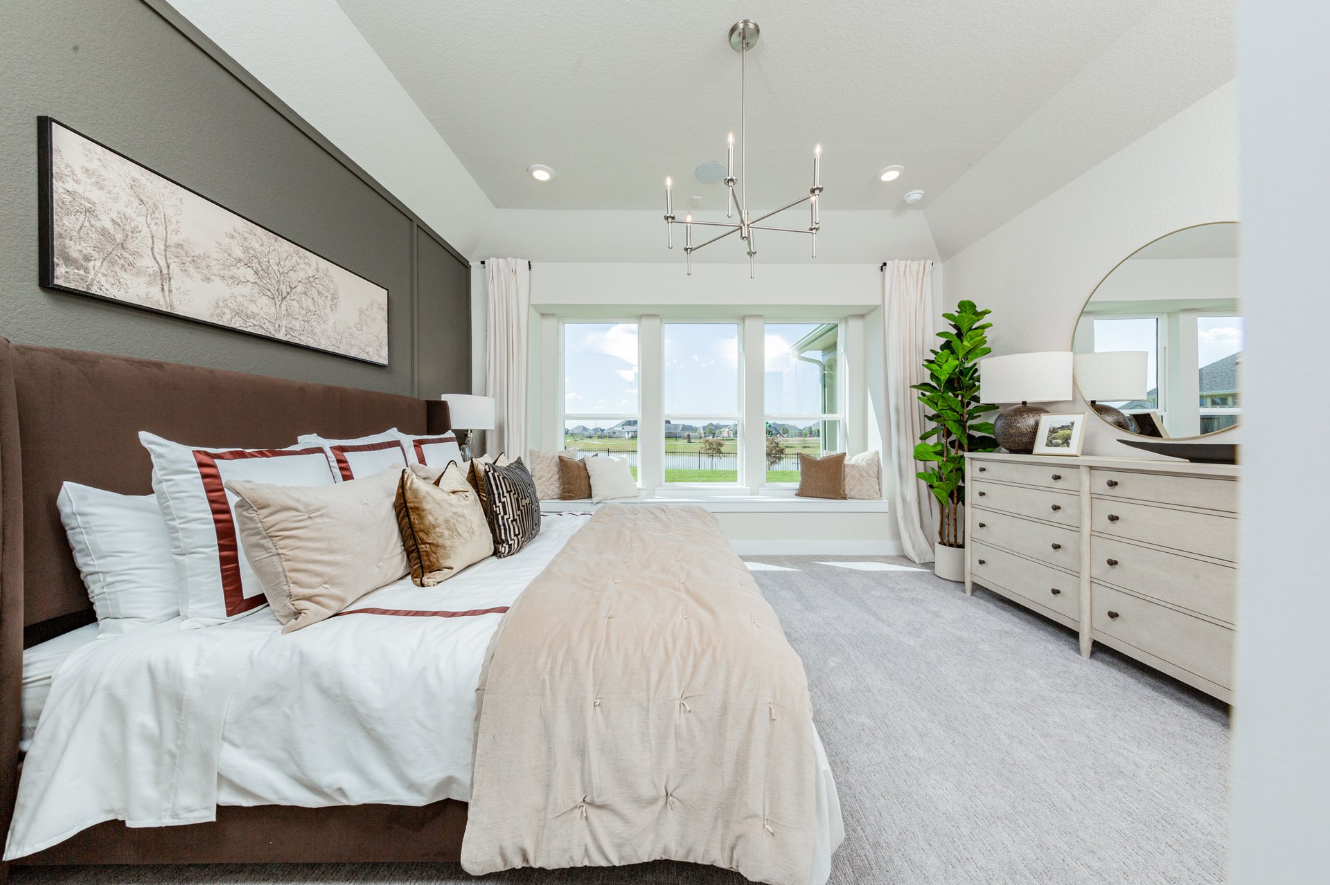 bedroom with art above bed