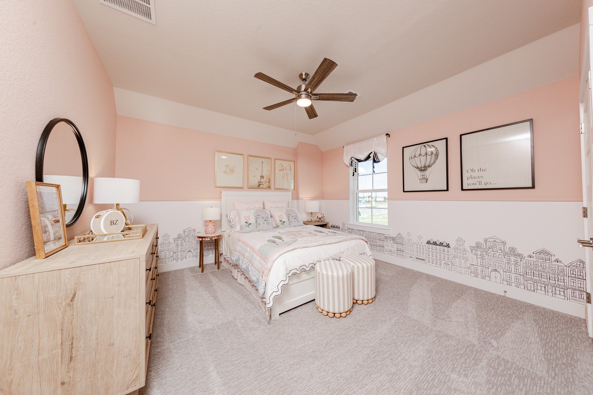 bedroom with pink painted walls and ceiling fan