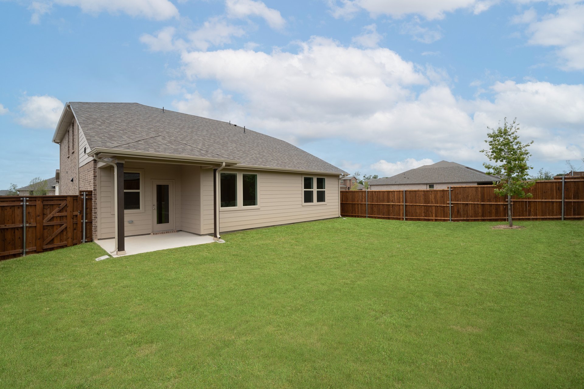 backyard with grass and covered patio