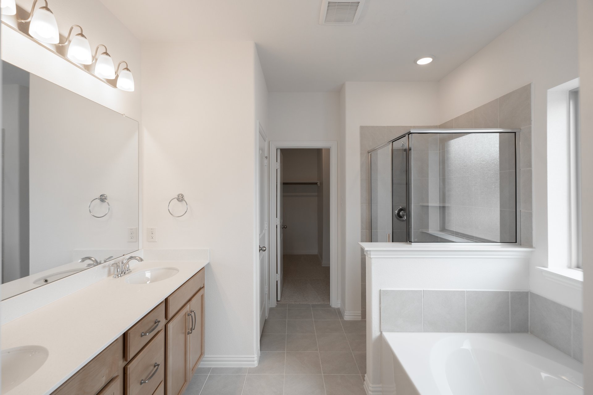 primary bathroom with soaking tub and walk-in shower