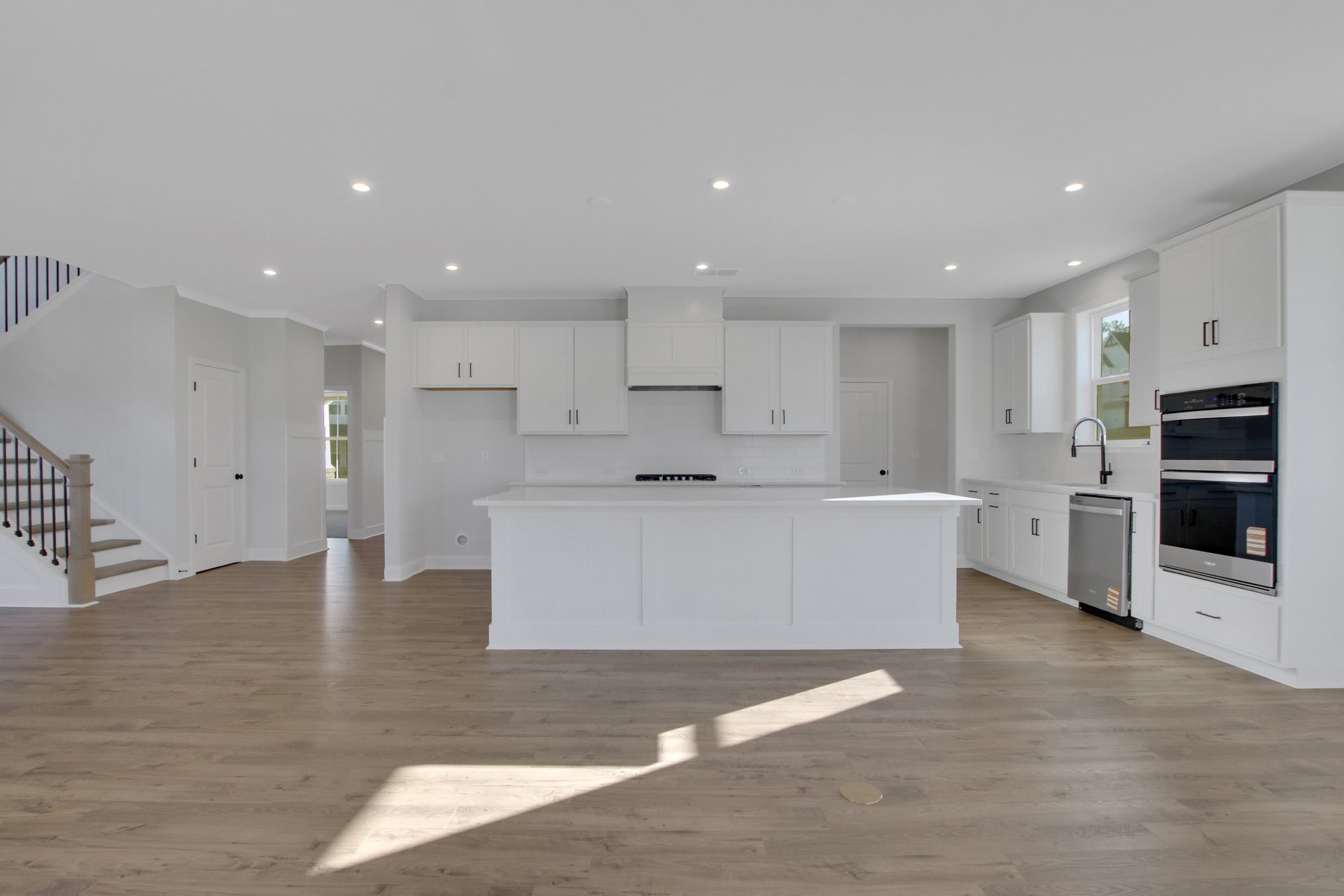 kitchen with white cabinets and quartz counters