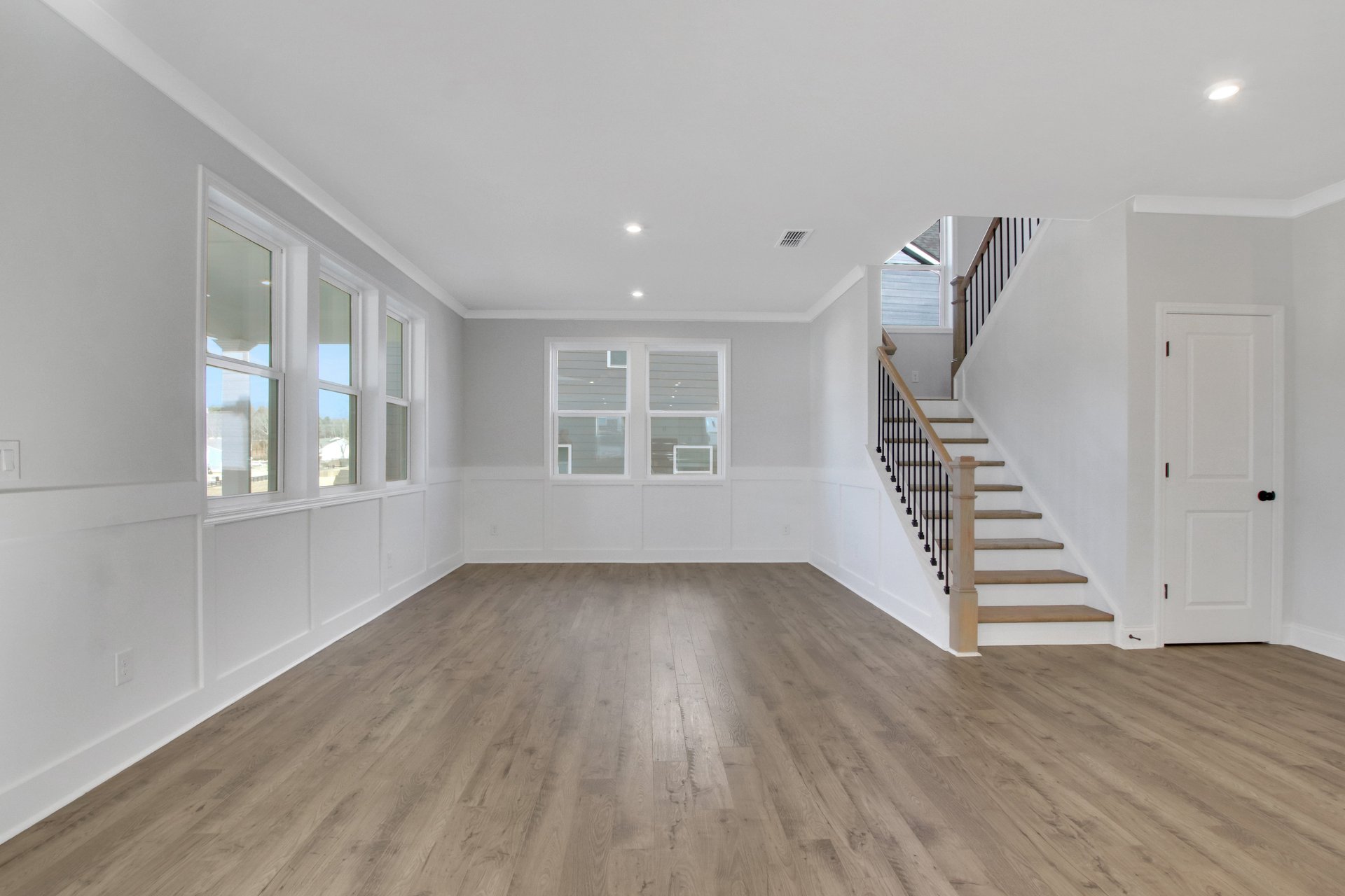 dining room with hard surface flooring and windows