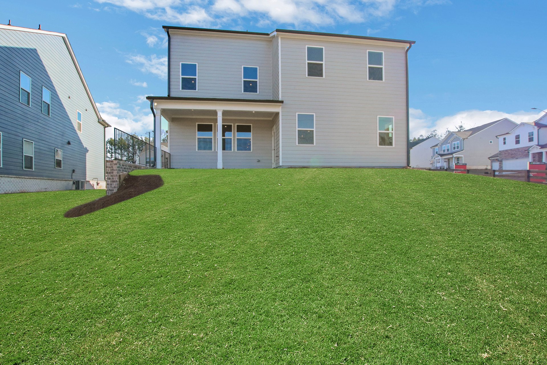 rear exterior of home with covered patio