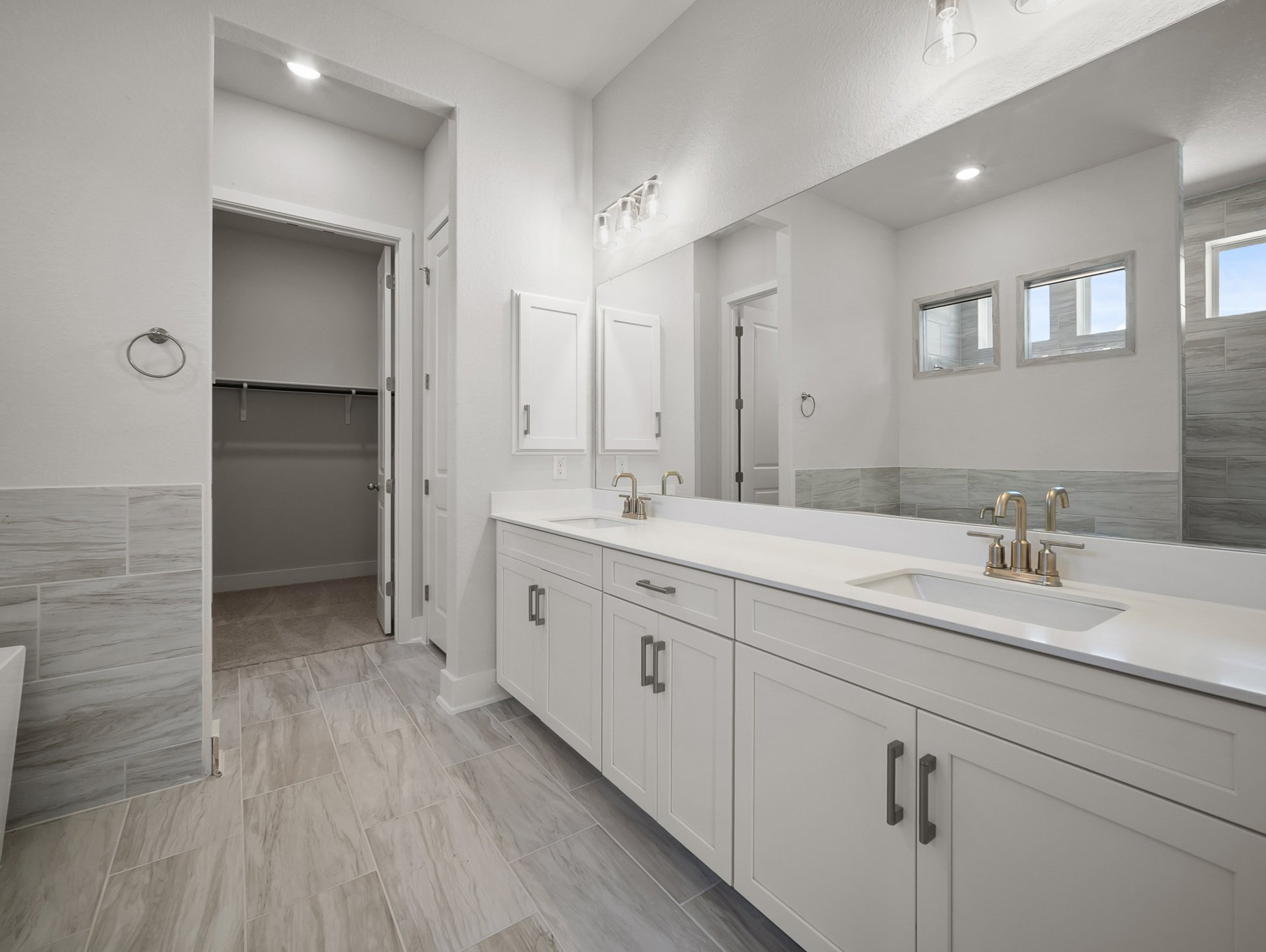 bathroom with soaking tub, walk-in shower & dual sinks