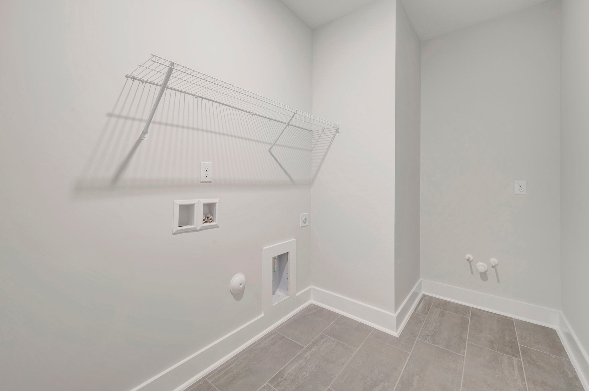laundry room with wire shelving