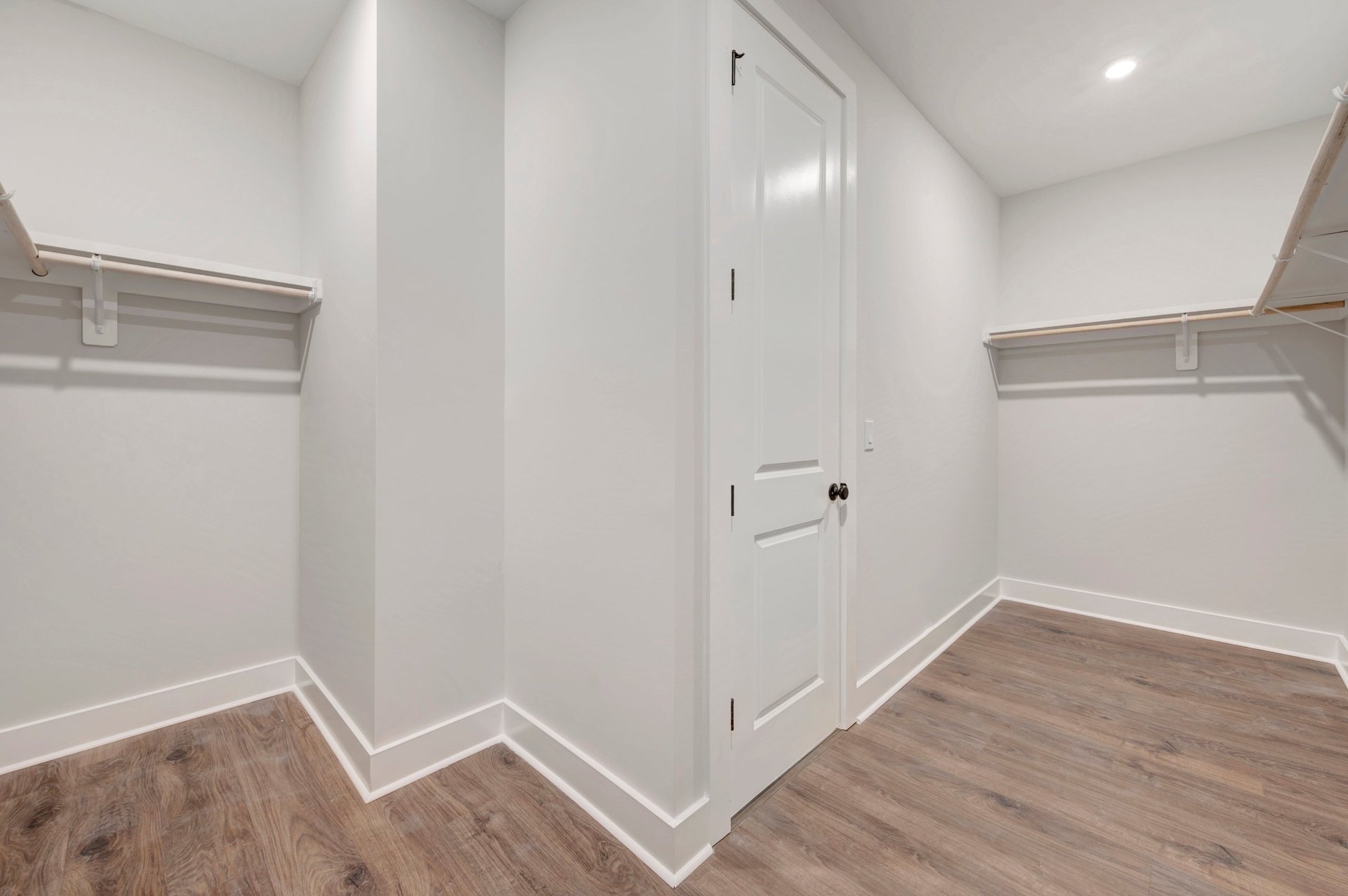primary closet with wood shelves