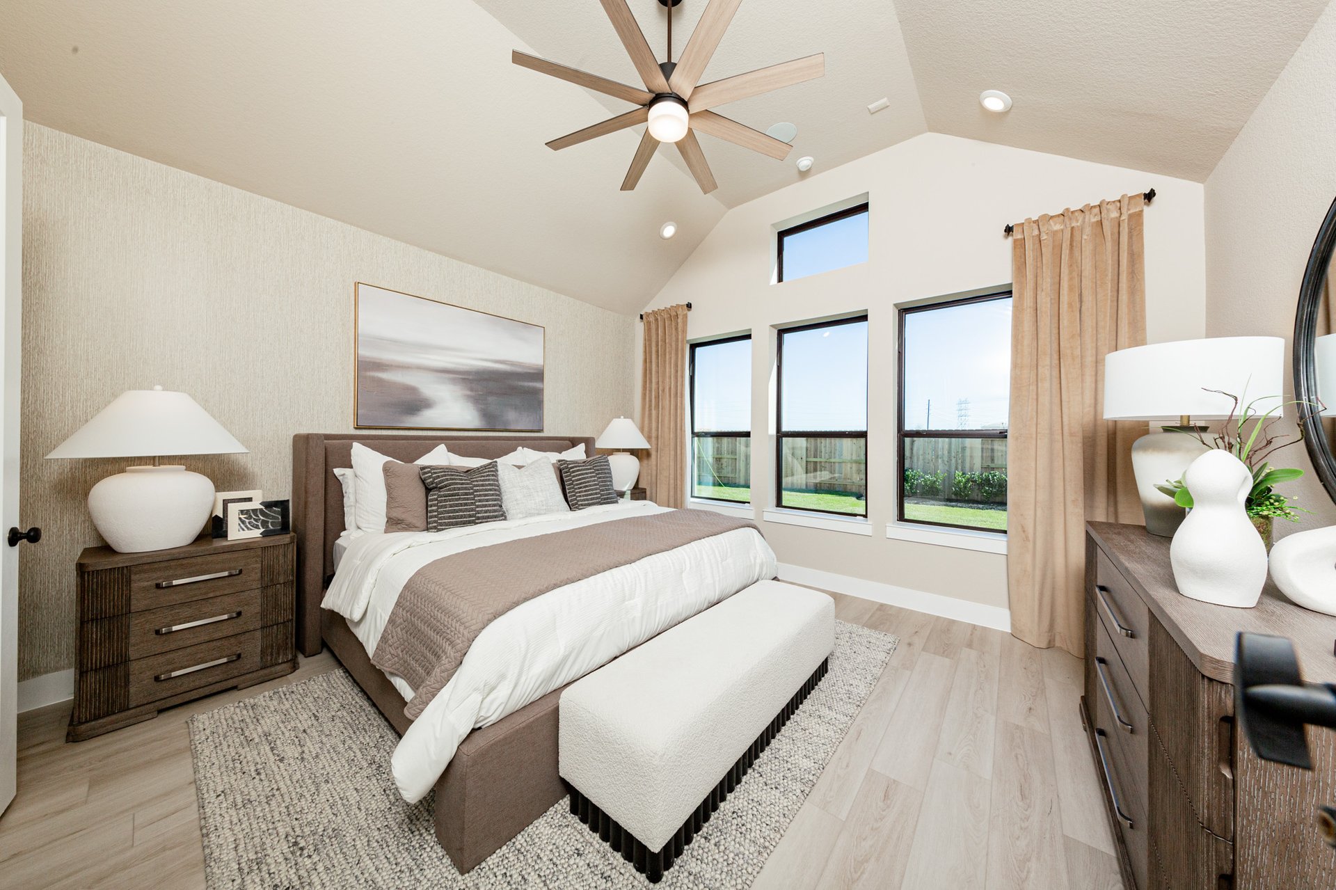 bedroom with 4 windows with ceiling fan 