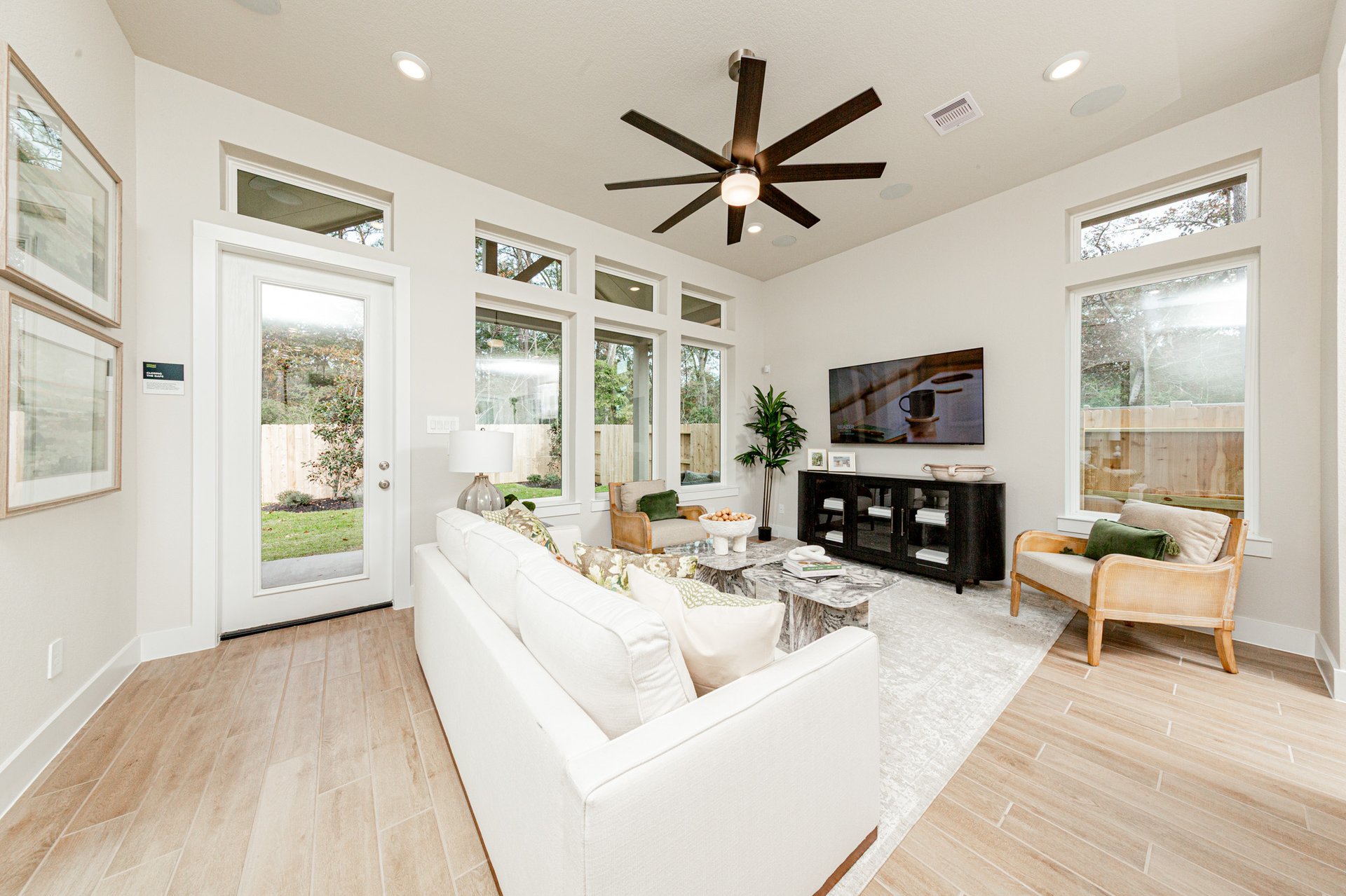 great room with ceiling fan
