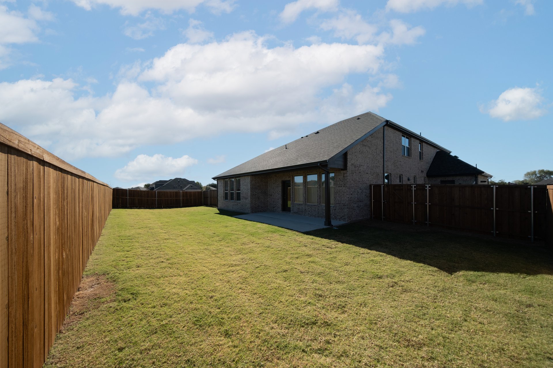 backyard of home with covered patio