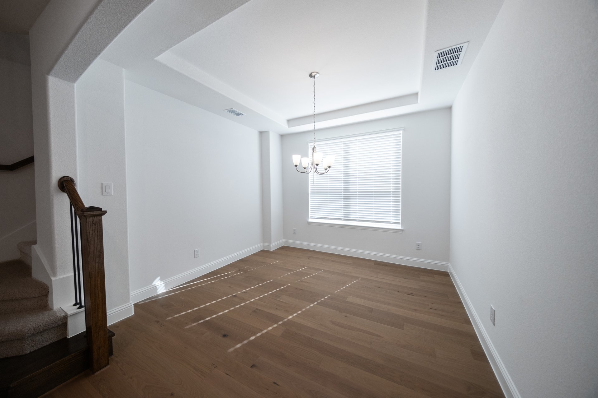 open dining room with hardwood flooring