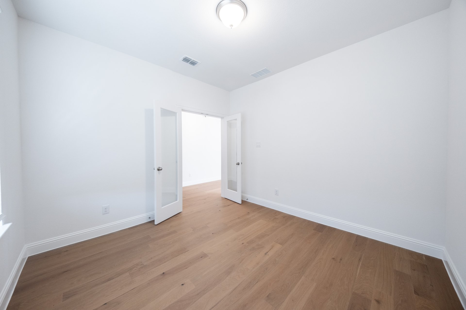 private study with hardwood flooring