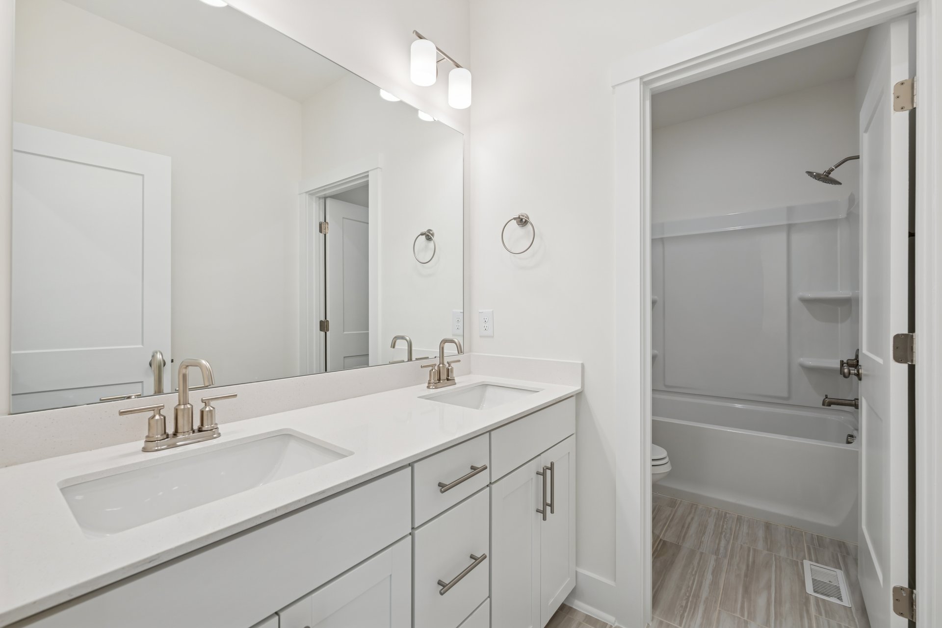 secondary bathroom with two sinks