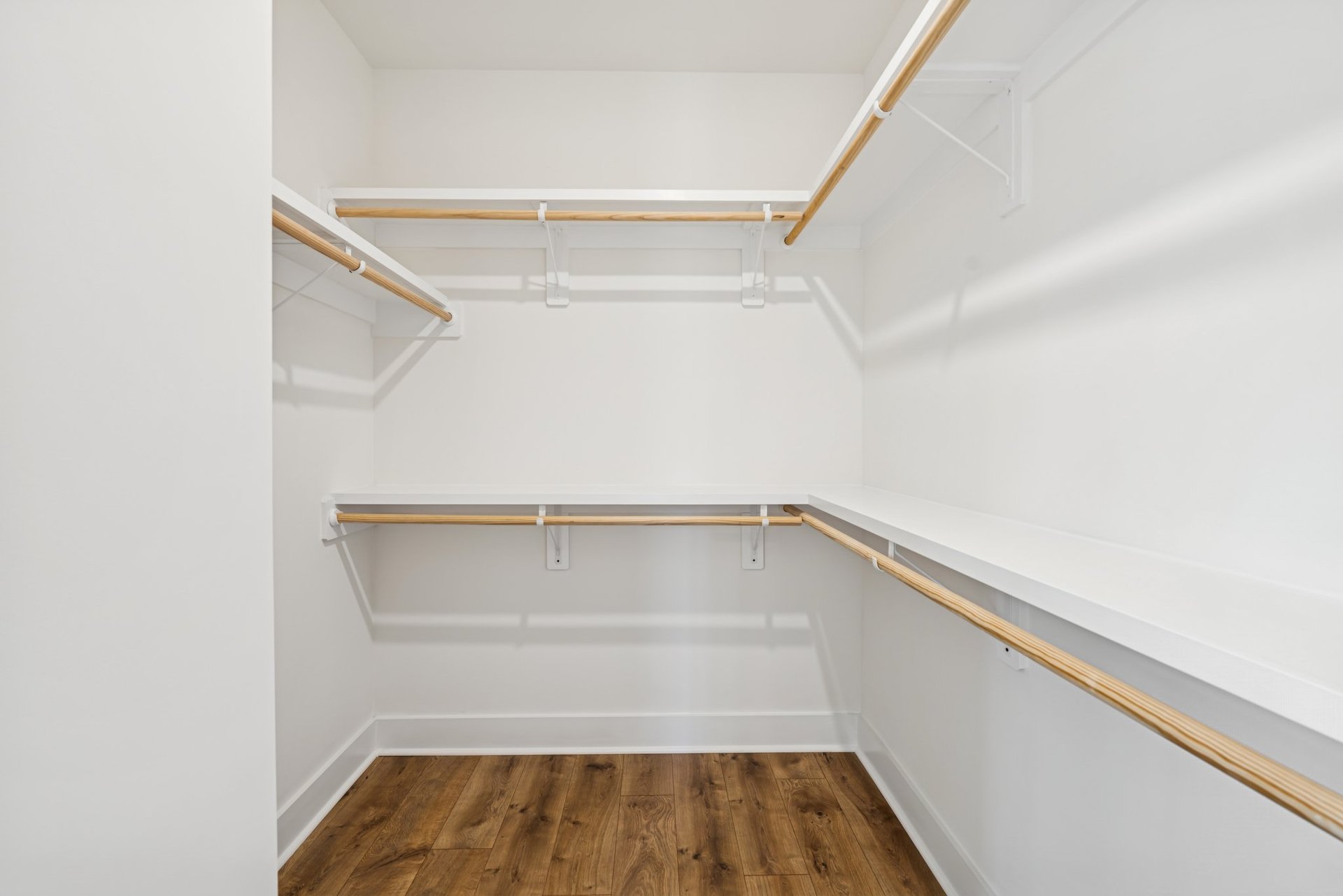 primary closet with wooden shelves