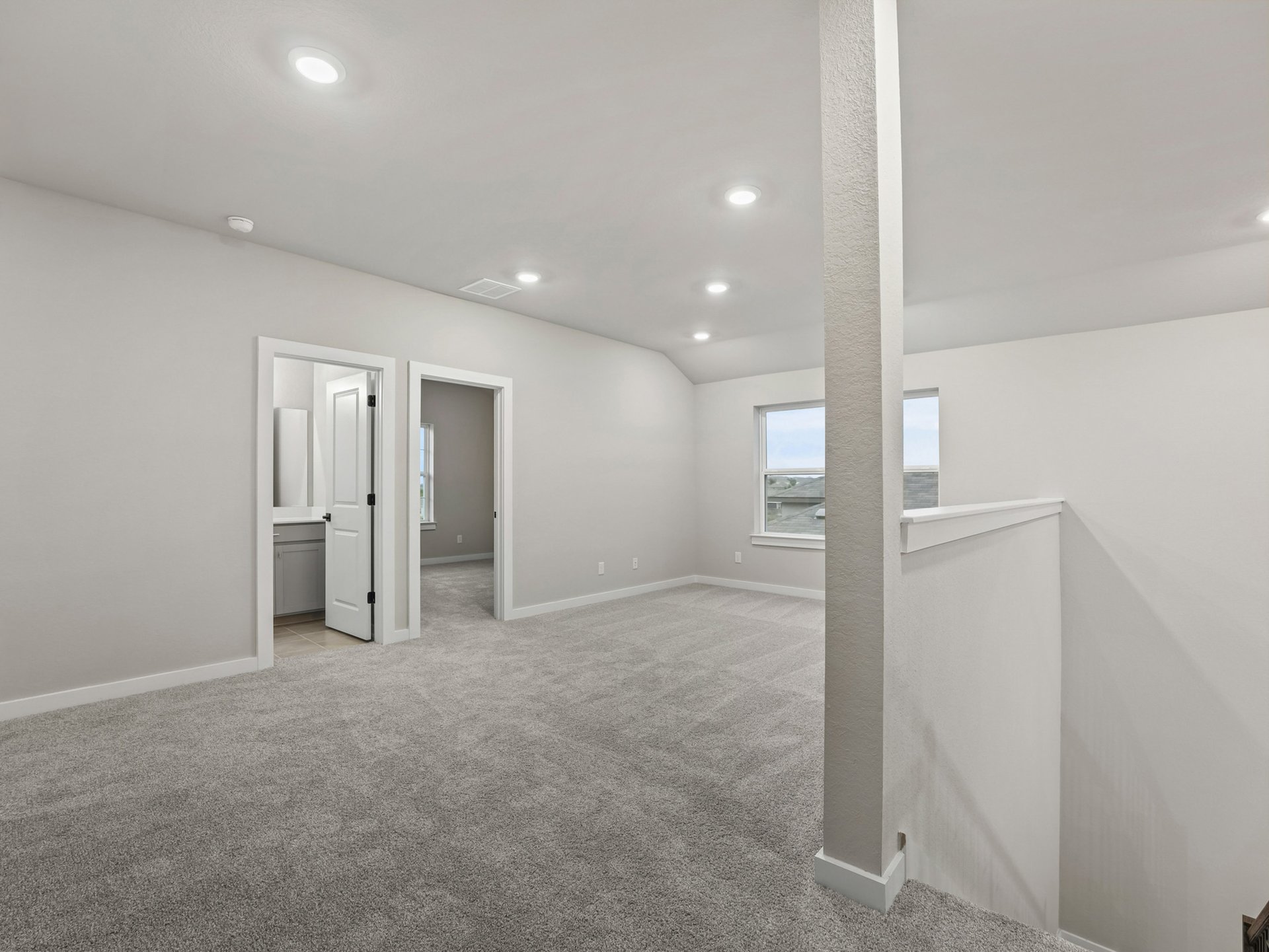 loft with carpet and windows