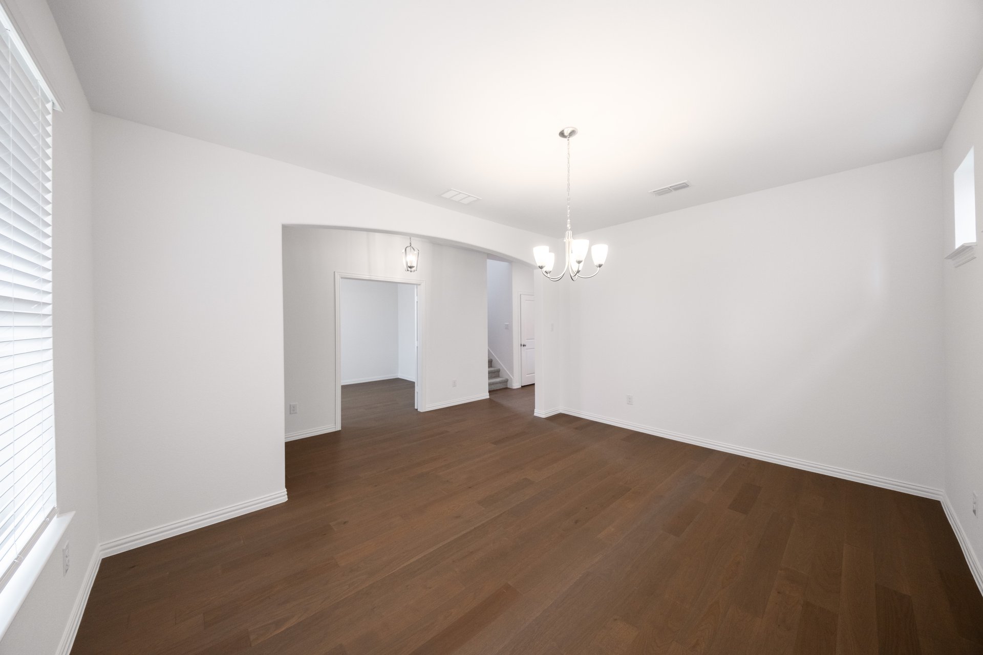 open dining room with hardwood flooring