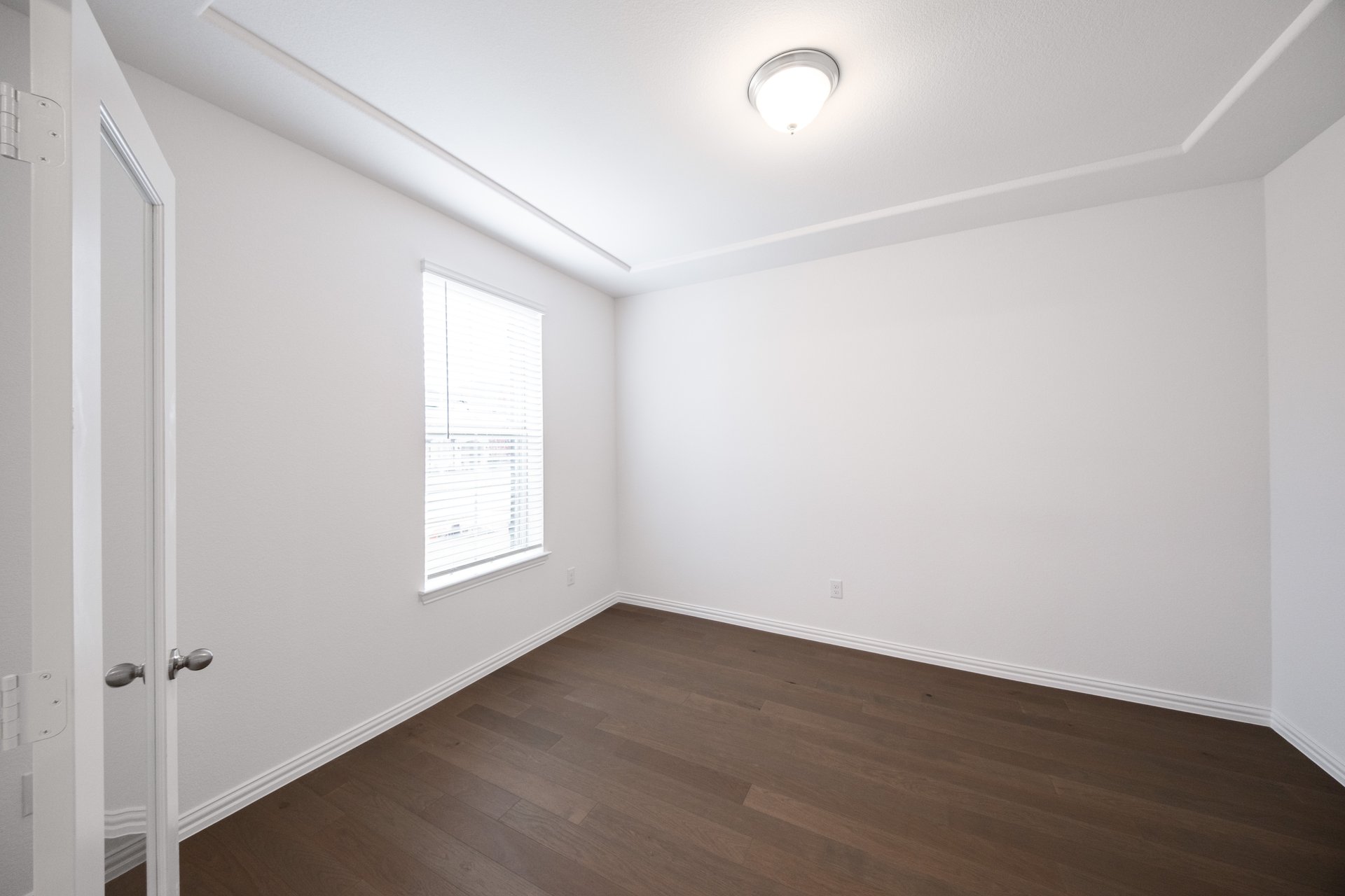 spacious study with hardwood flooring