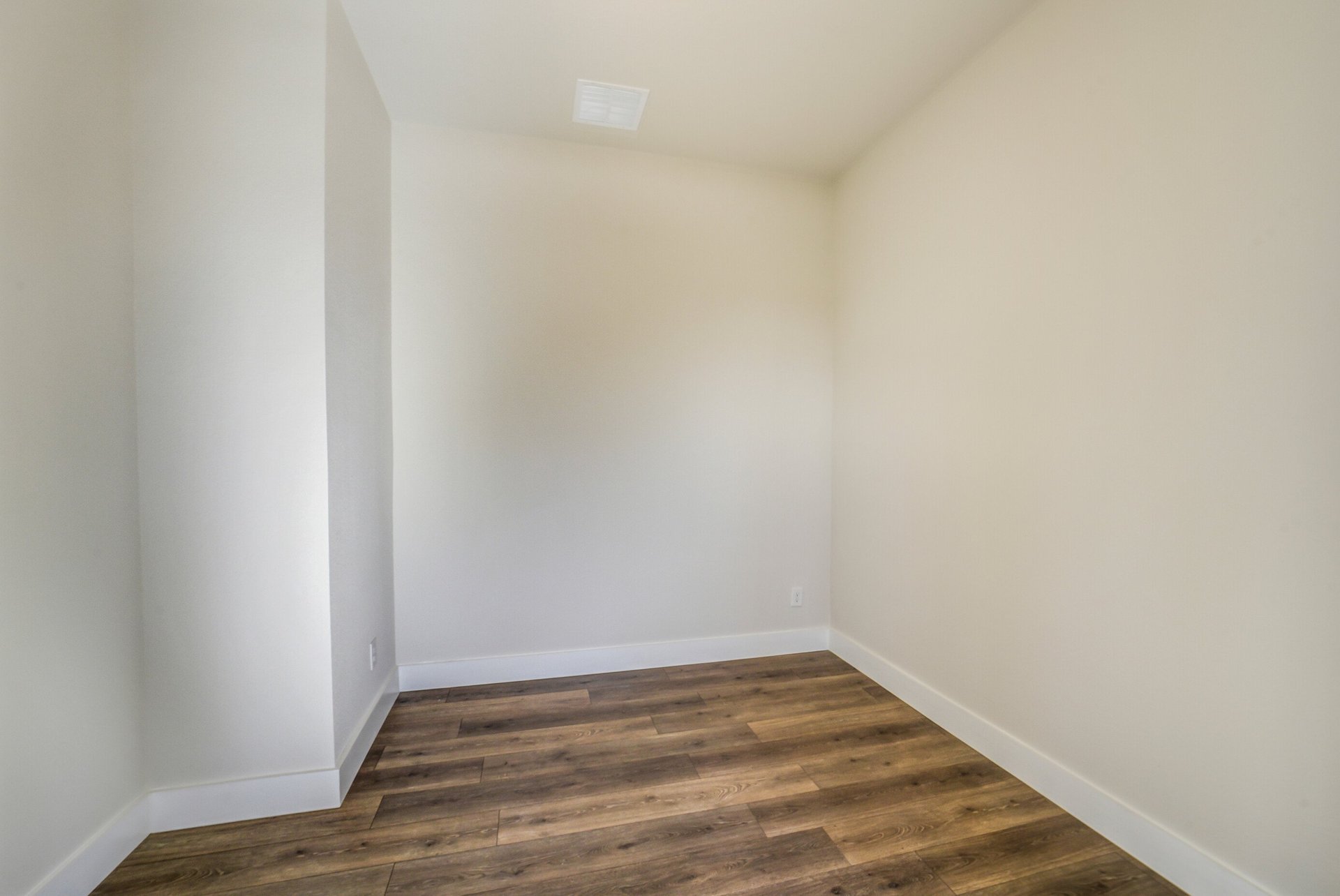 private study with hardwood flooring