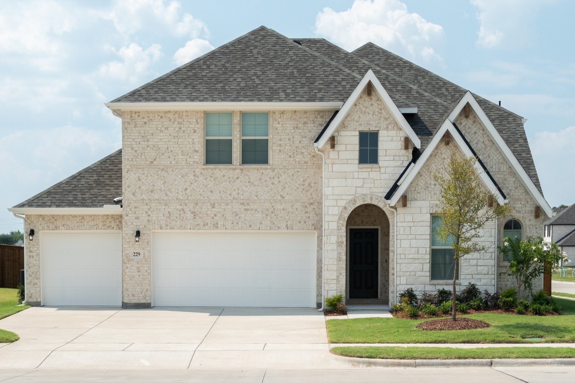 home exterior with brick and stone 