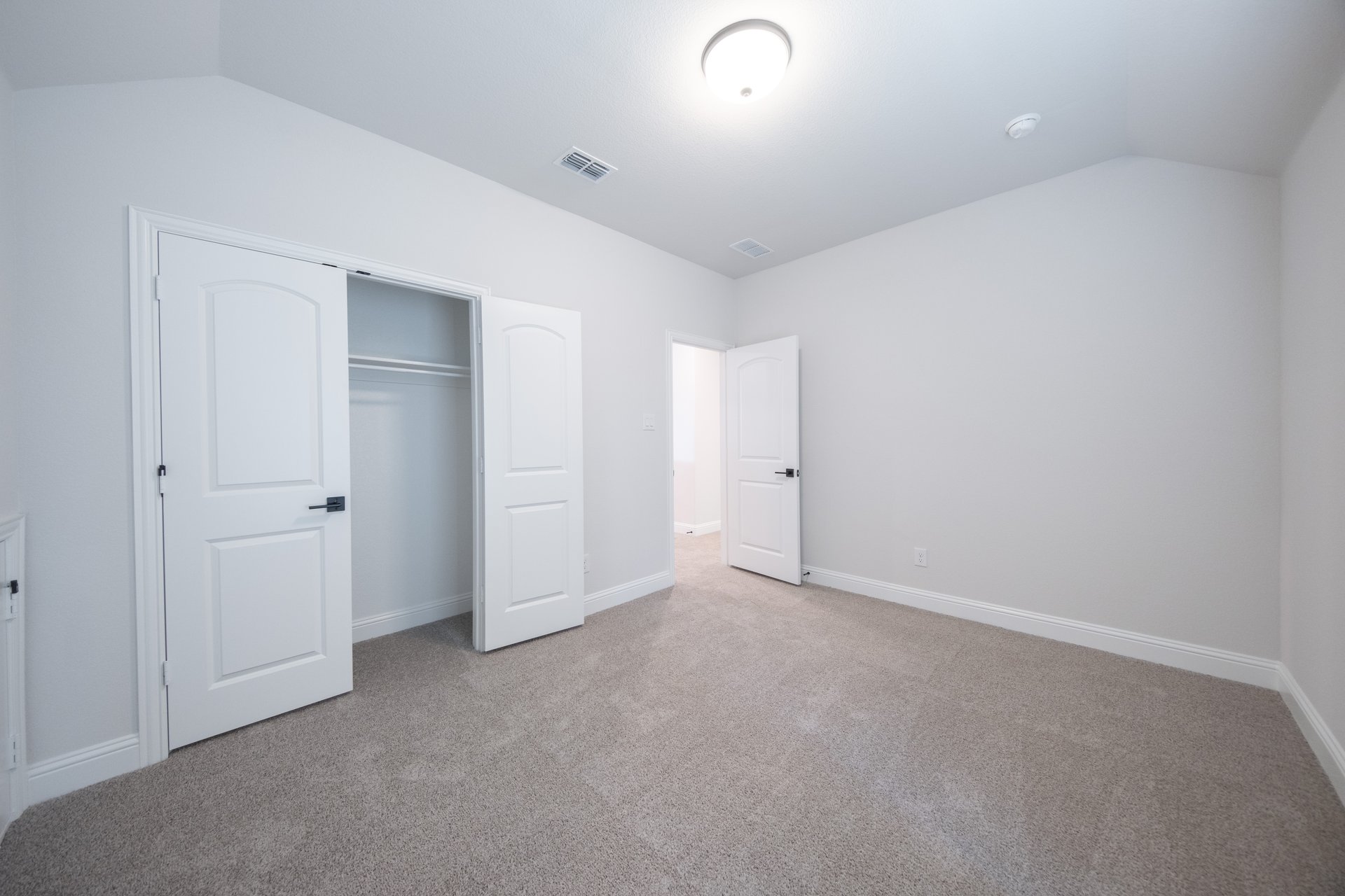 bedroom with closet and carpet